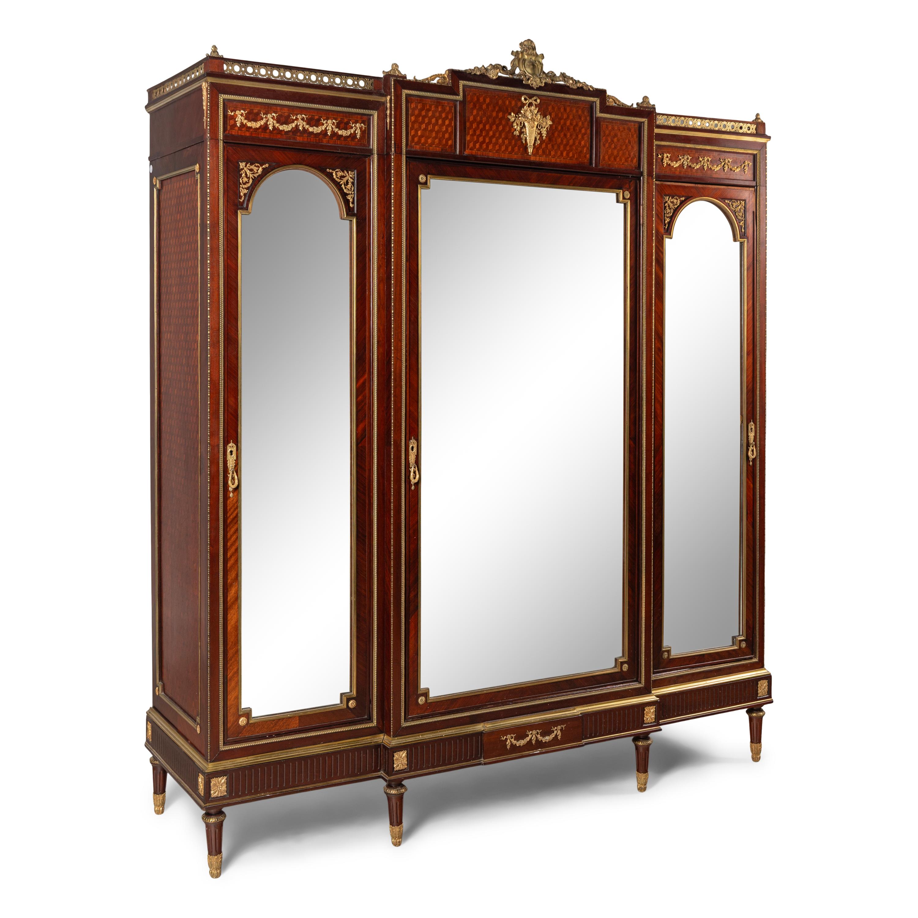 A Louis XVI Style Mahogany, Parquetry and Gilt Bronze Mounted Dressing Cabinet