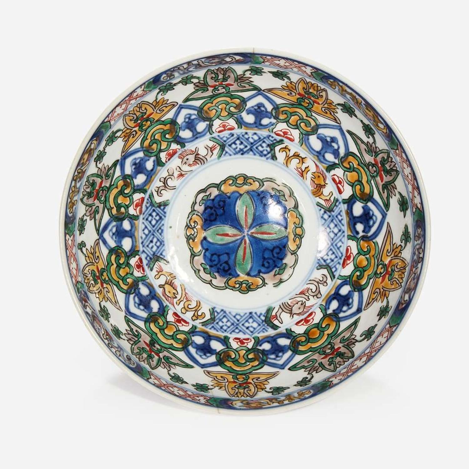 A Chinese wucai-decorated bowl, "mantou xin", and a Chinese blue and white porcelain Gu-form vase The bowl Kangxi period, the vase later