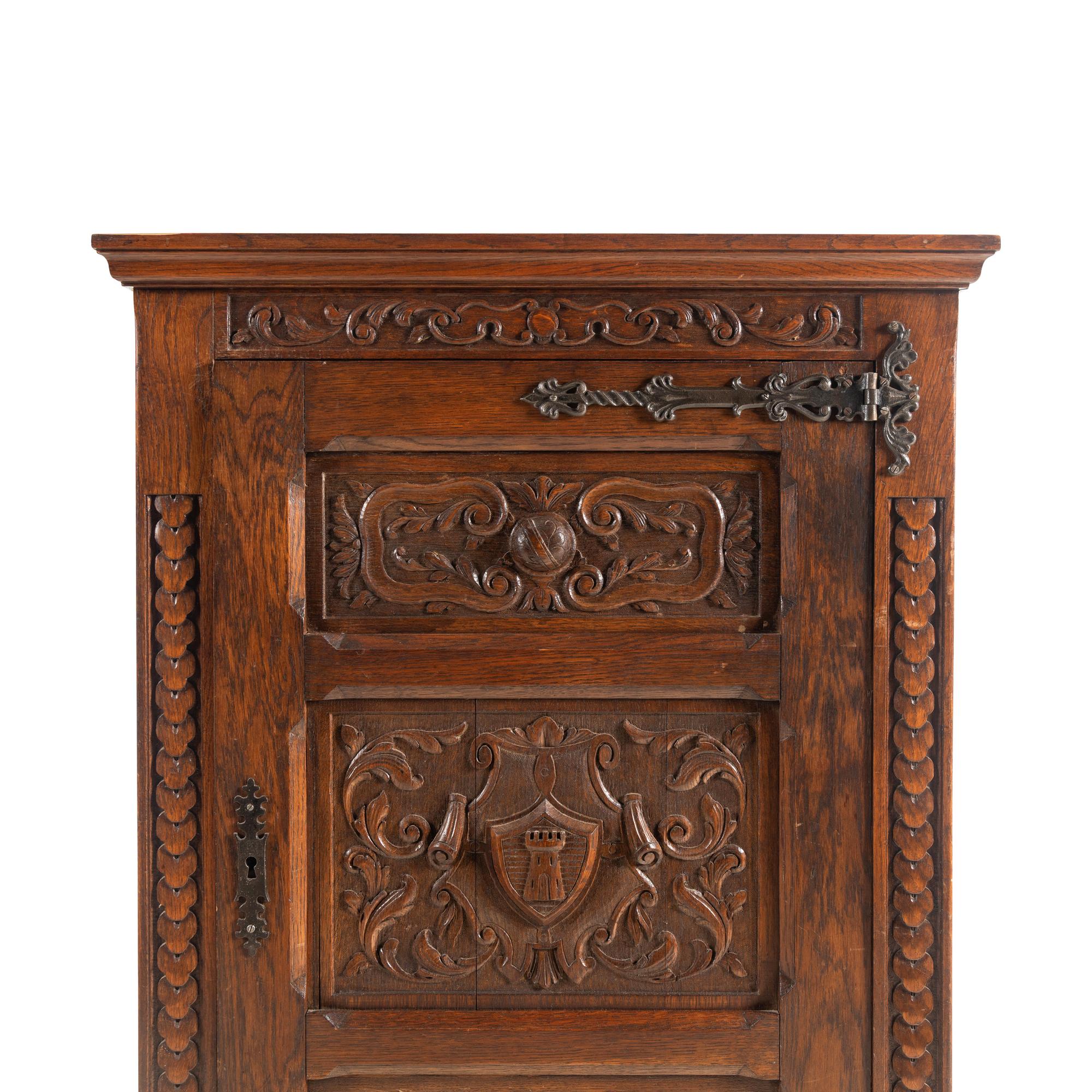 A Baroque Style Carved Oak Cabinet