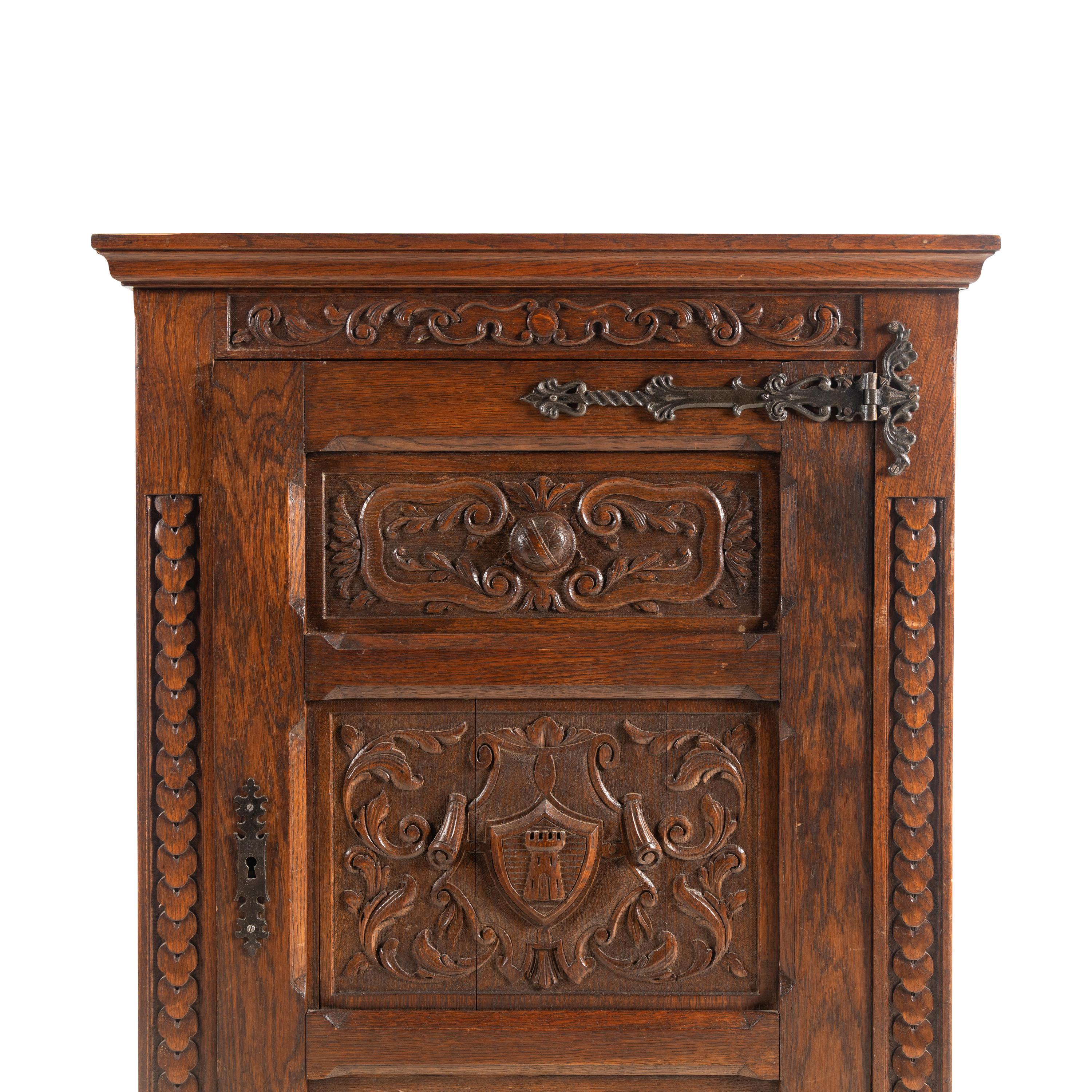A Baroque Style Carved Oak Cabinet