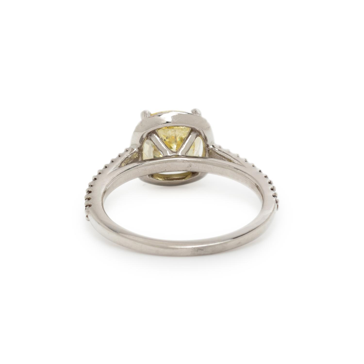 FANCY INTENSE YELLOW DIAMOND AND DIAMOND RING