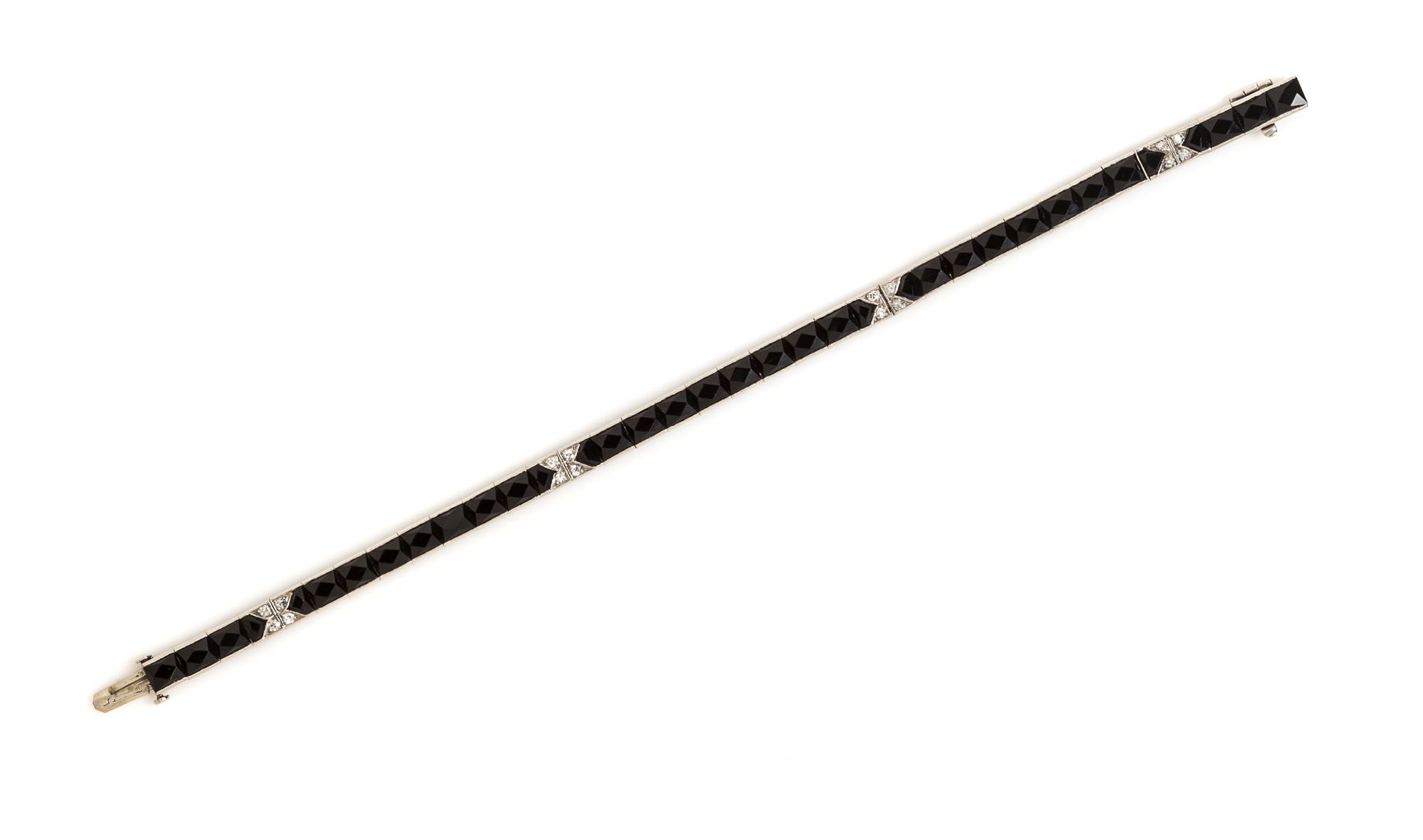 An Art Deco Platinum, Onyx and Diamond Line Bracelet, 12.70 dwts.