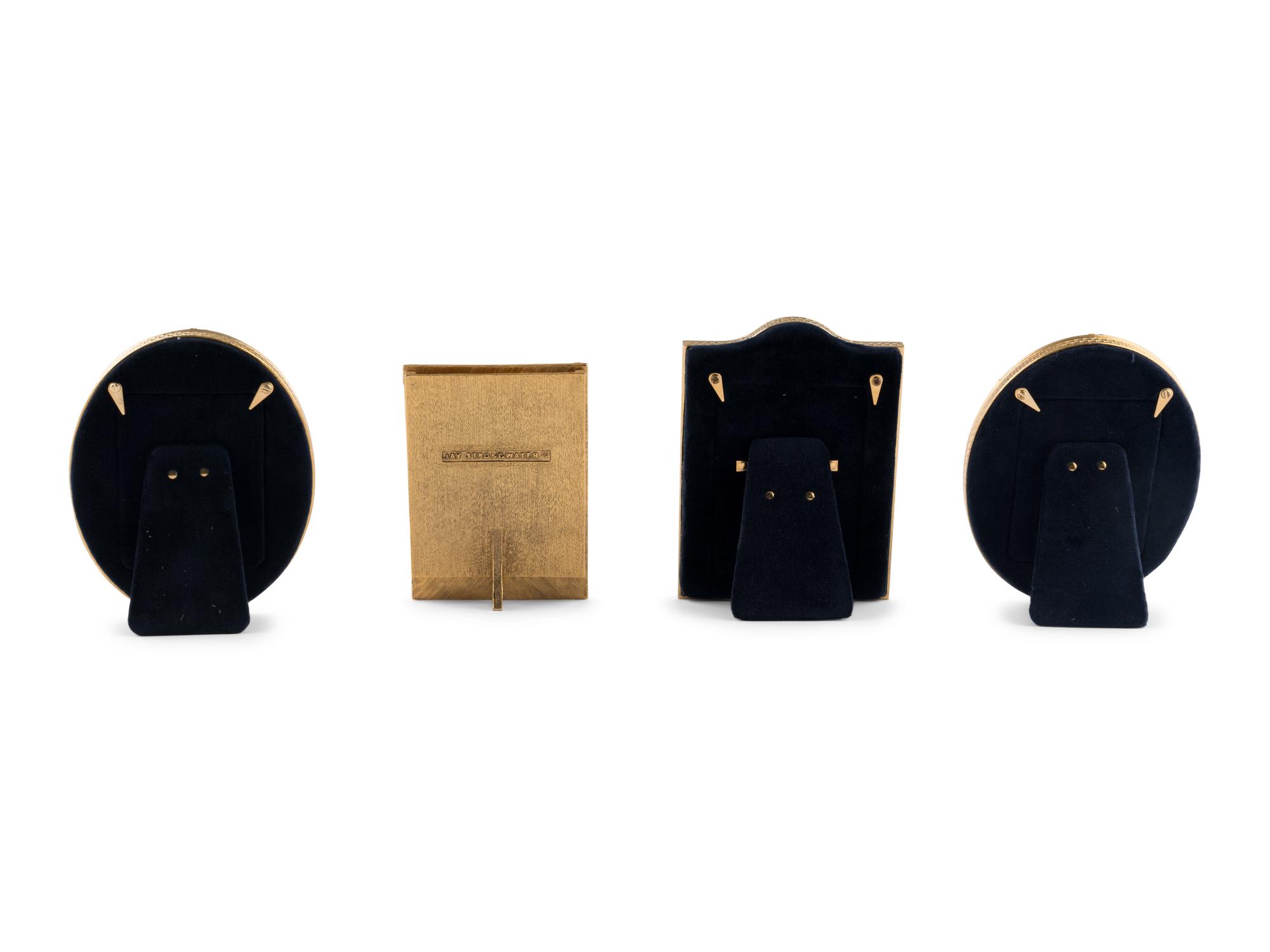 A Group of Four English Enamel and Gilt-Metal Picture Frames