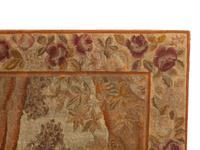 A Tapestry Panel Depicting a Couple Observing a Sleeping Putto
