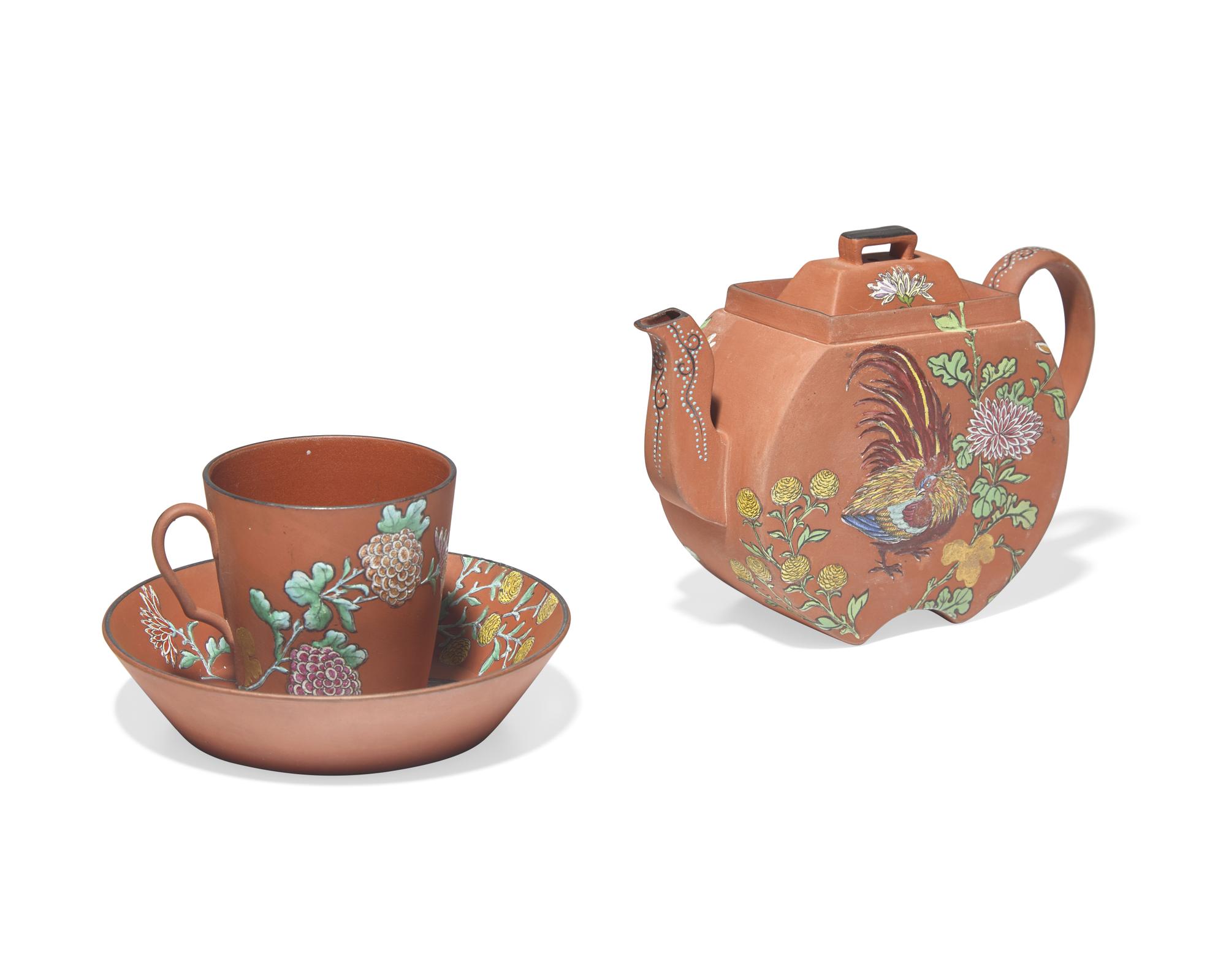 A Wedgwood Rosso Antico Teapot, Cup and Saucer