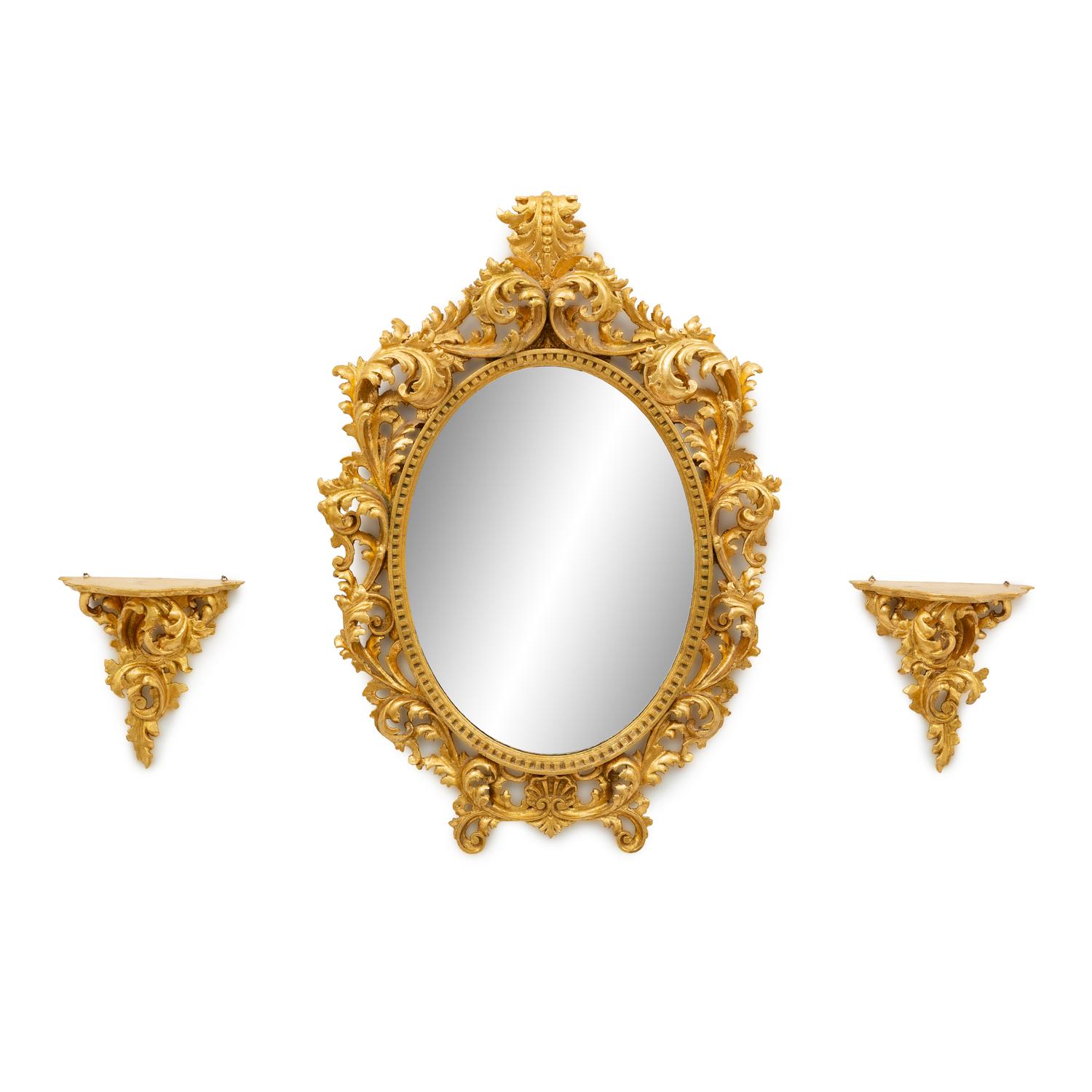 An Italian Rococo Style Carved Giltwood Oval Mirror and a Pair of Wall Brackets