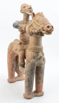 A Group of Neolithic and Pre-Columbian Style Pottery Articles Height of tallest 20 inches.