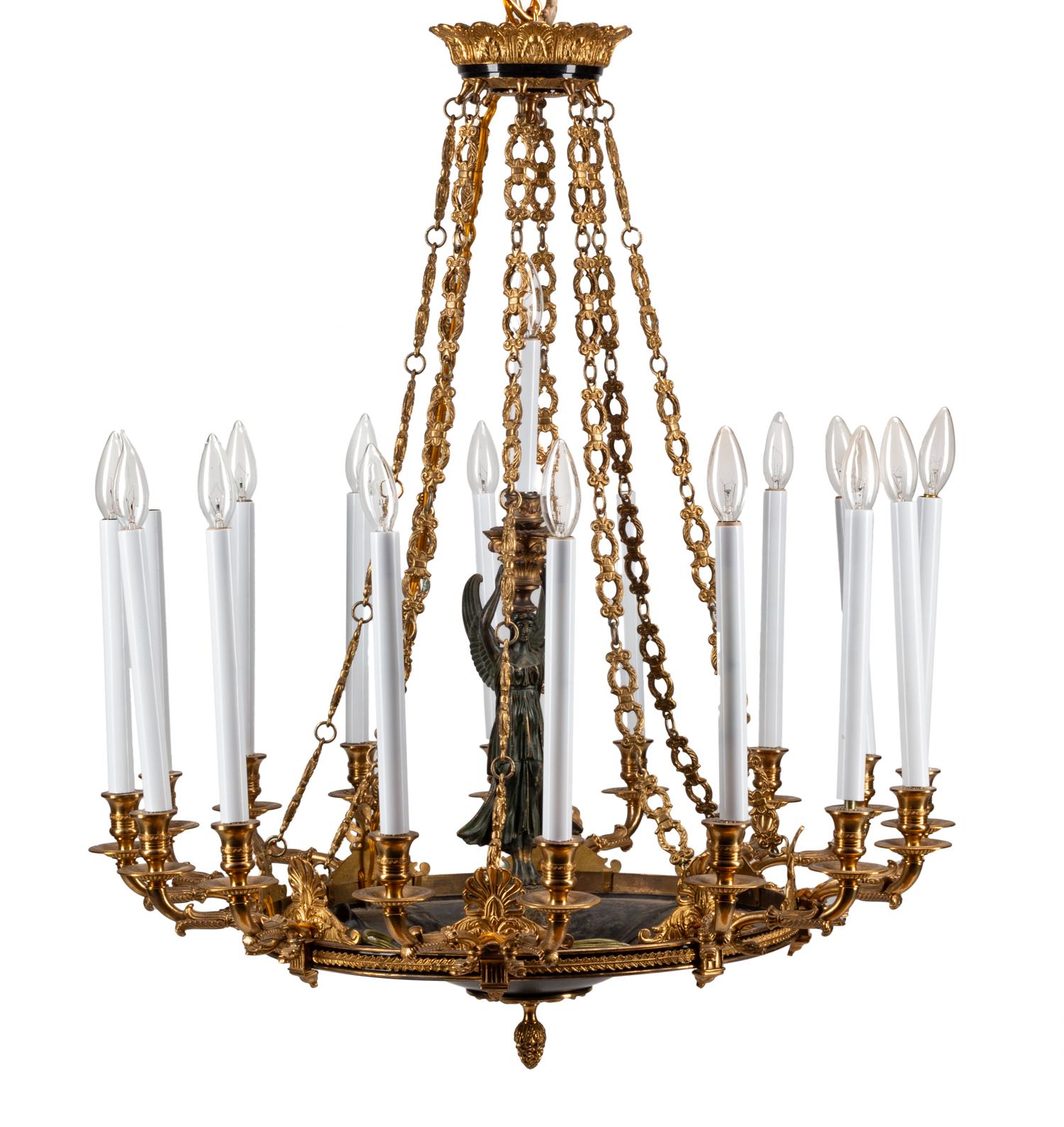 An Empire Style Gilt Bronze and Tole Sixteen-Light Chandelier