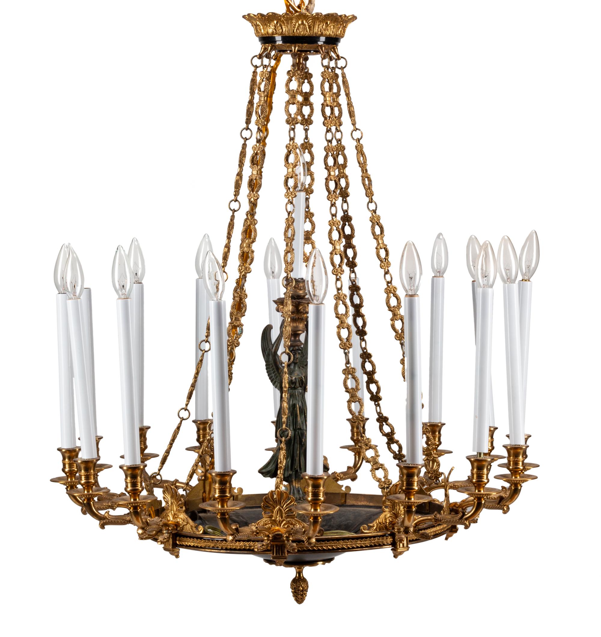 An Empire Style Gilt Bronze and Tole Sixteen-Light Chandelier