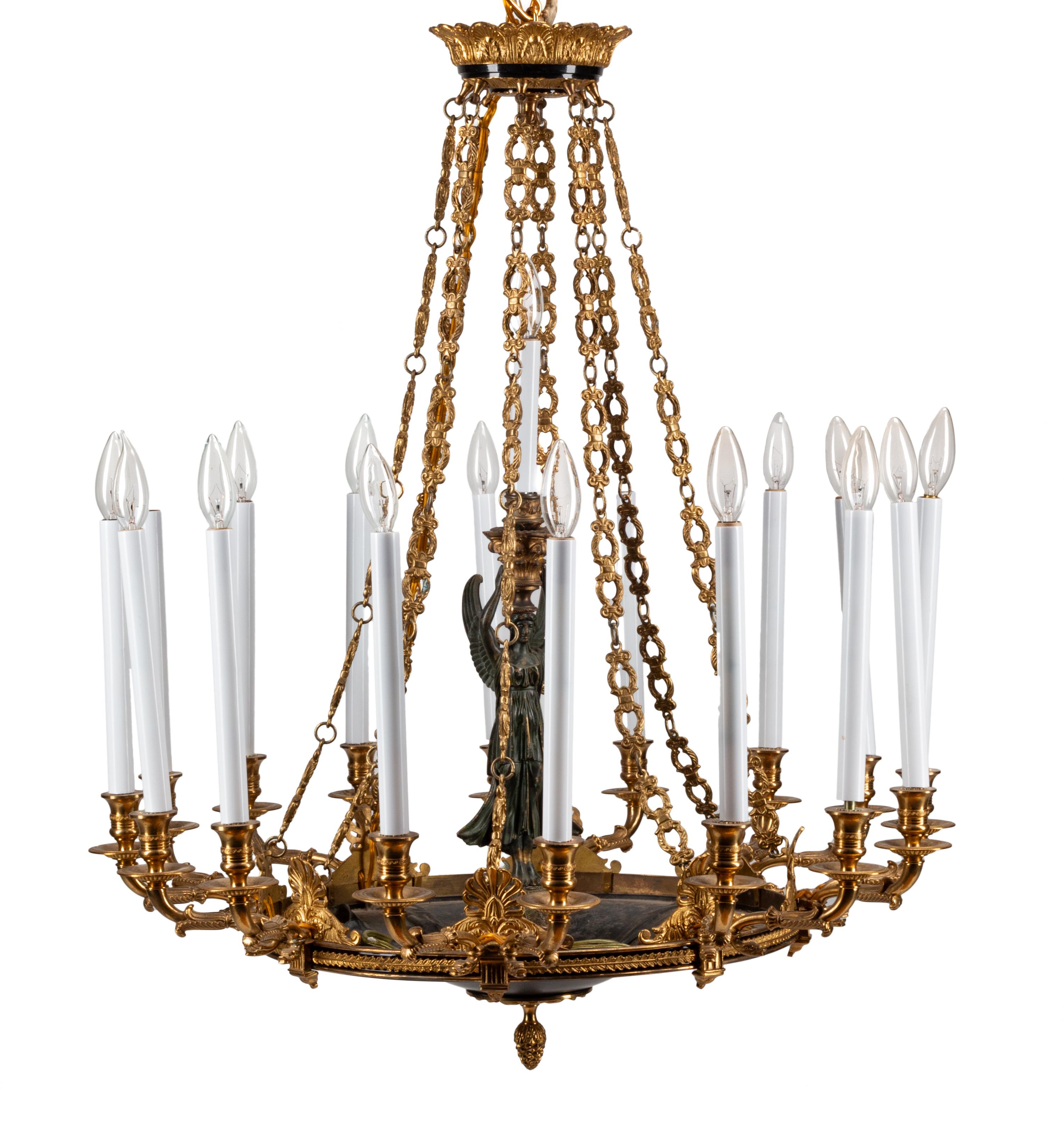 An Empire Style Gilt Bronze and Tole Sixteen-Light Chandelier