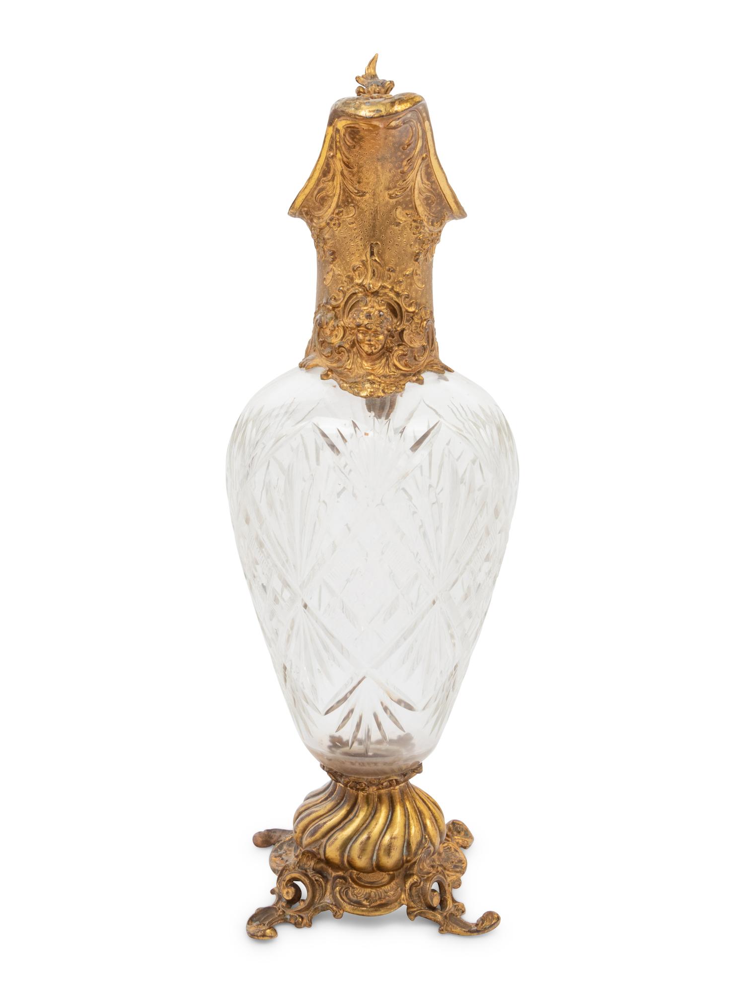 A Gilt Metal Mounted Cut Glass Claret Jug
