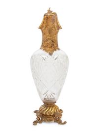 A Gilt Metal Mounted Cut Glass Claret Jug