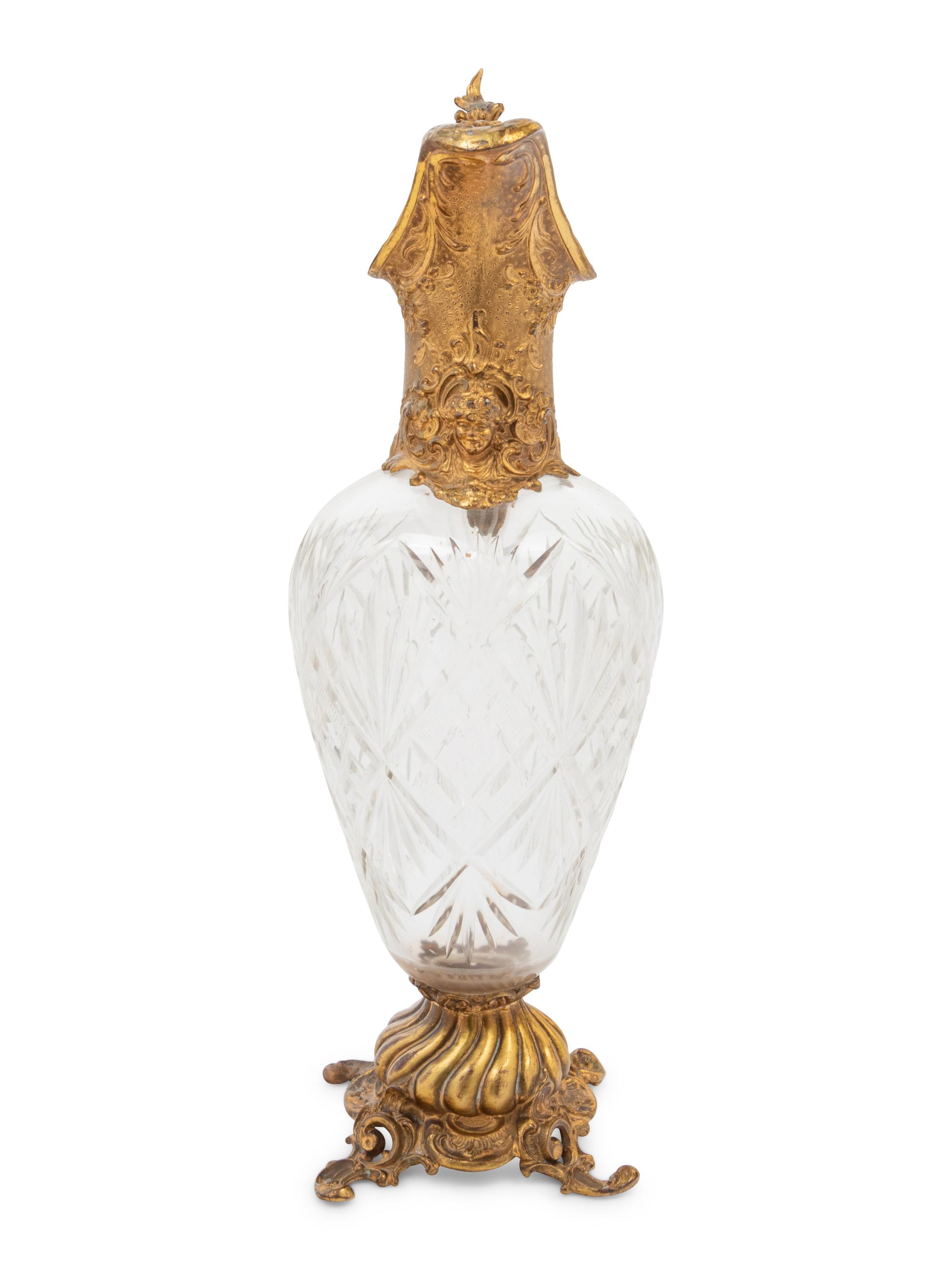 A Gilt Metal Mounted Cut Glass Claret Jug