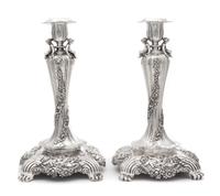 A Pair of American Silver Candlesticks, Tiffany & Co., New York, Circa 1900, each fluted urn form candle cup worked to show floral spra