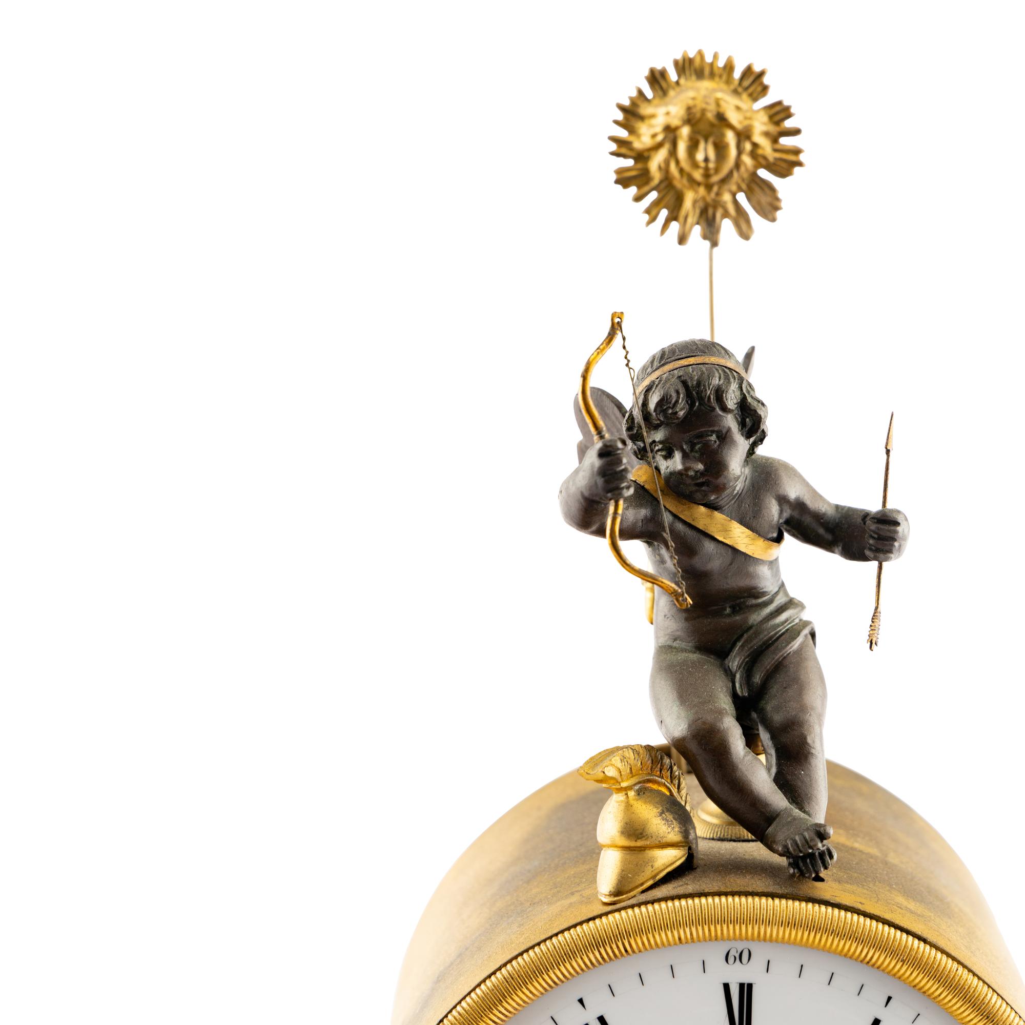 An Empire Style Gilt and Patinated Bronze Mantel Clock