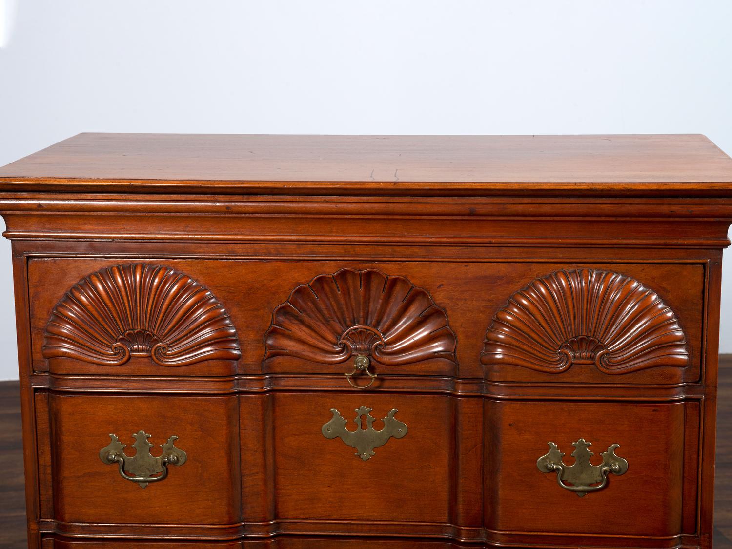 A Chippendale Shell-and-Block Carved Cherrywood Chest of Drawers