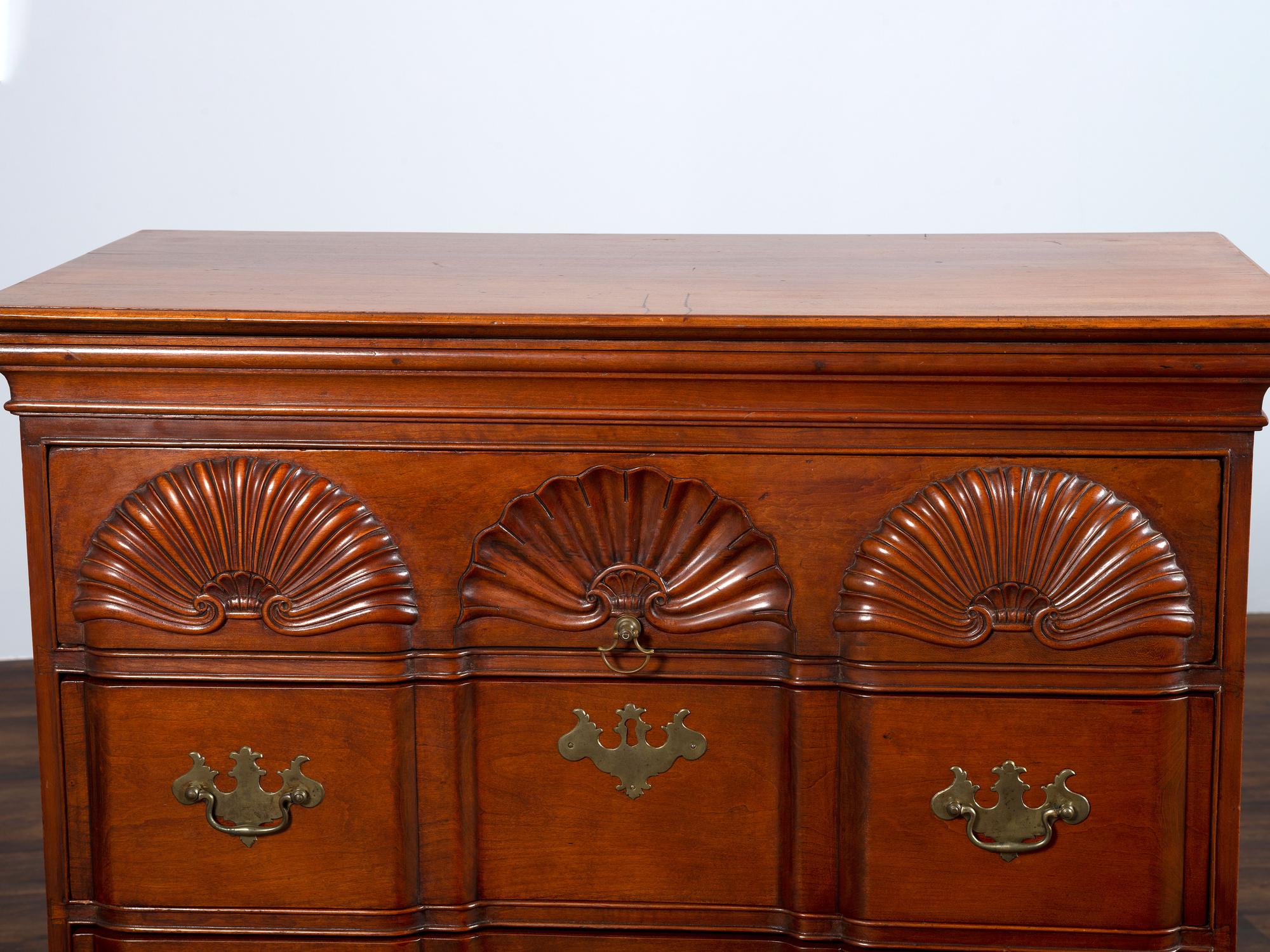 A Chippendale Shell-and-Block Carved Cherrywood Chest of Drawers
