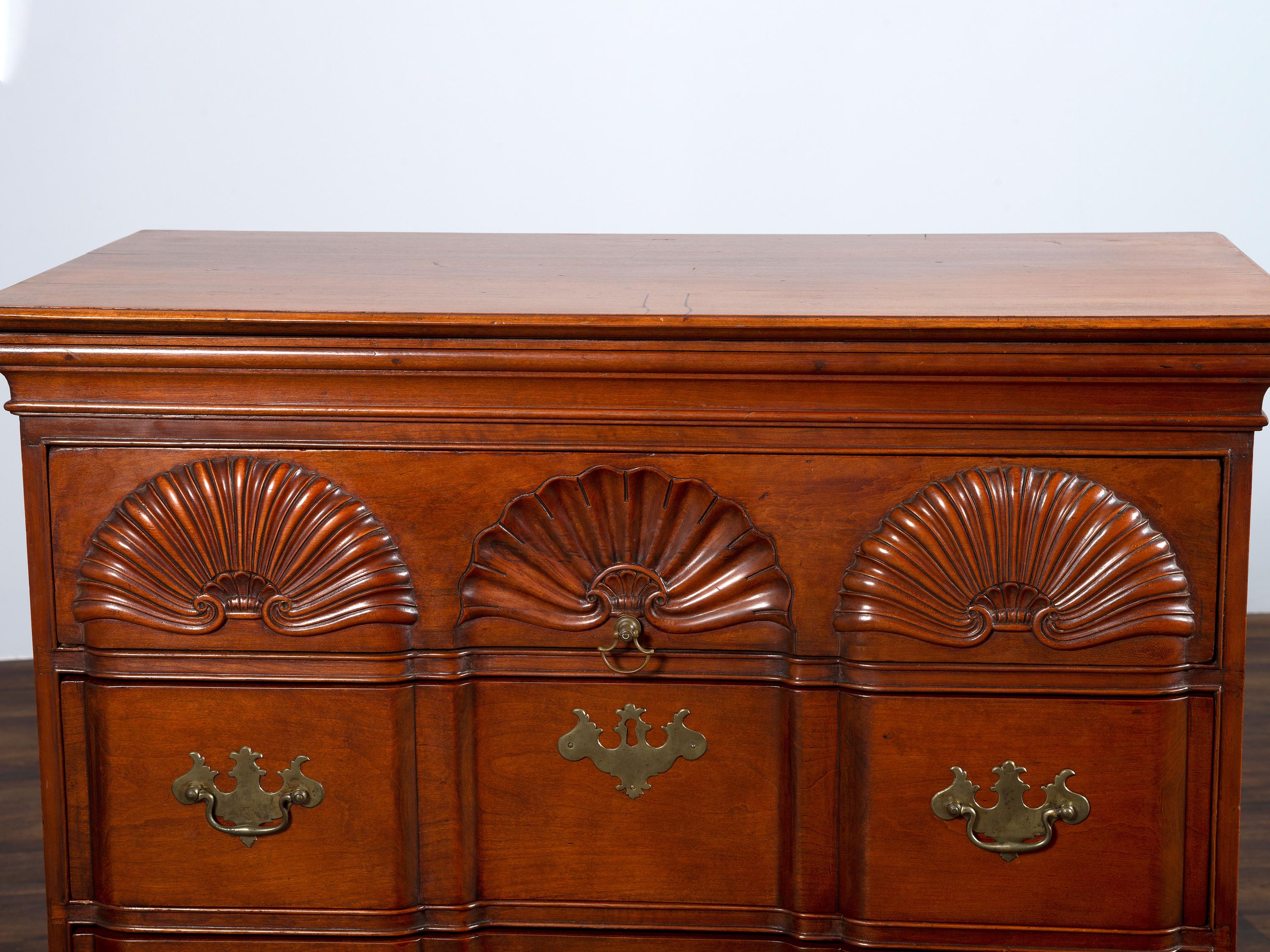 A Chippendale Shell-and-Block Carved Cherrywood Chest of Drawers