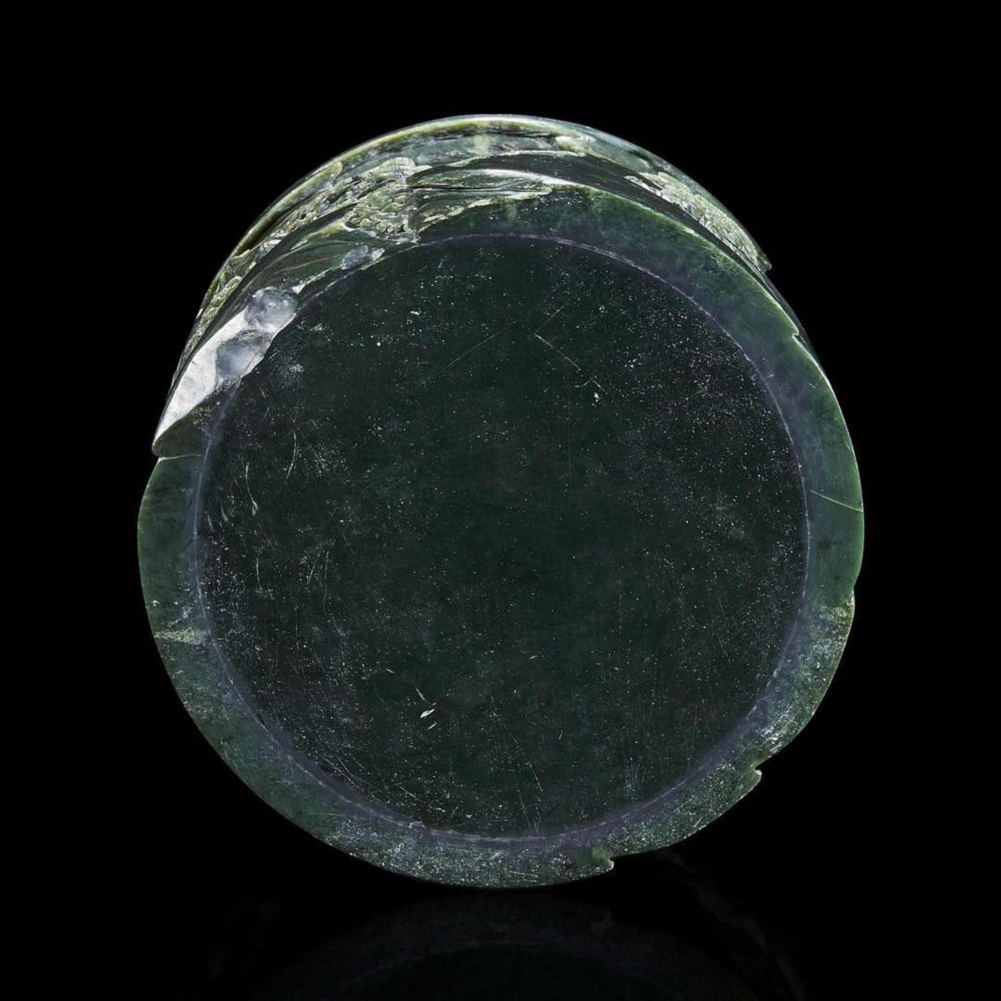 A Chinese carved dark green hardstone brushpot with marble-inlaid wood stand