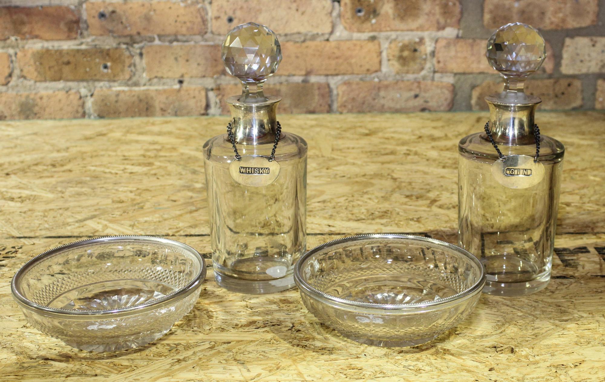 A Pair of Glass Decanters Height of tallest 9 5/8 inches. — MID-CENTURY