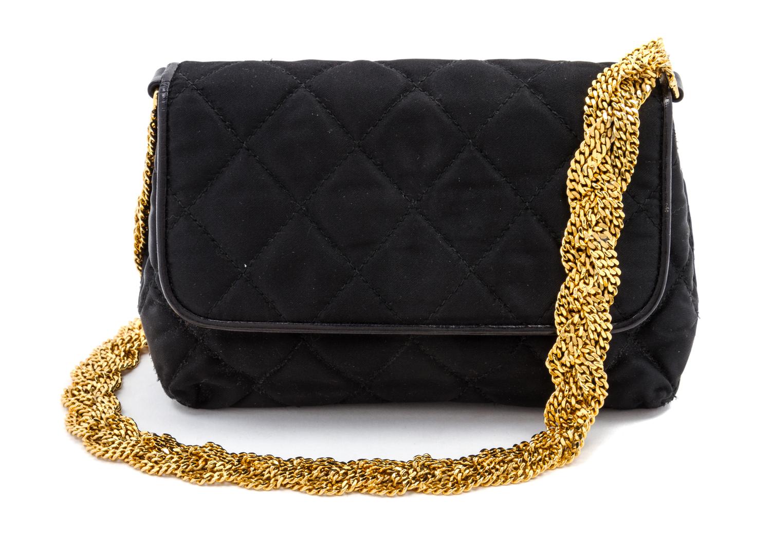 A Chanel Black Satin Quilted Bag, 7 1/2 x 4 1/2 x 2 1/2 inches.