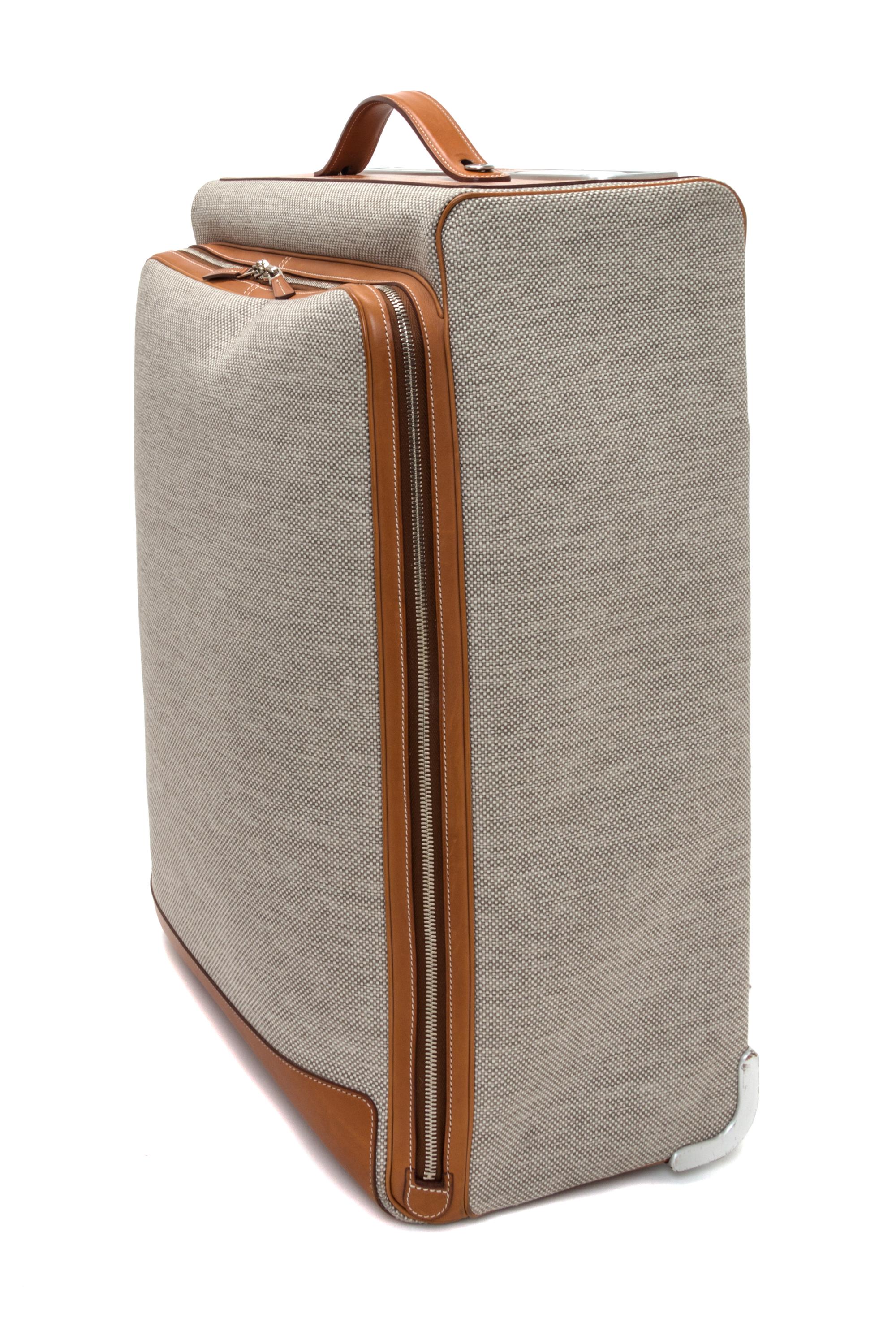 An Hermes Ecru Canvas and Fawn Barenia Calfskin Caleche-Express Suitcase, 14" x 21.5" x 10".