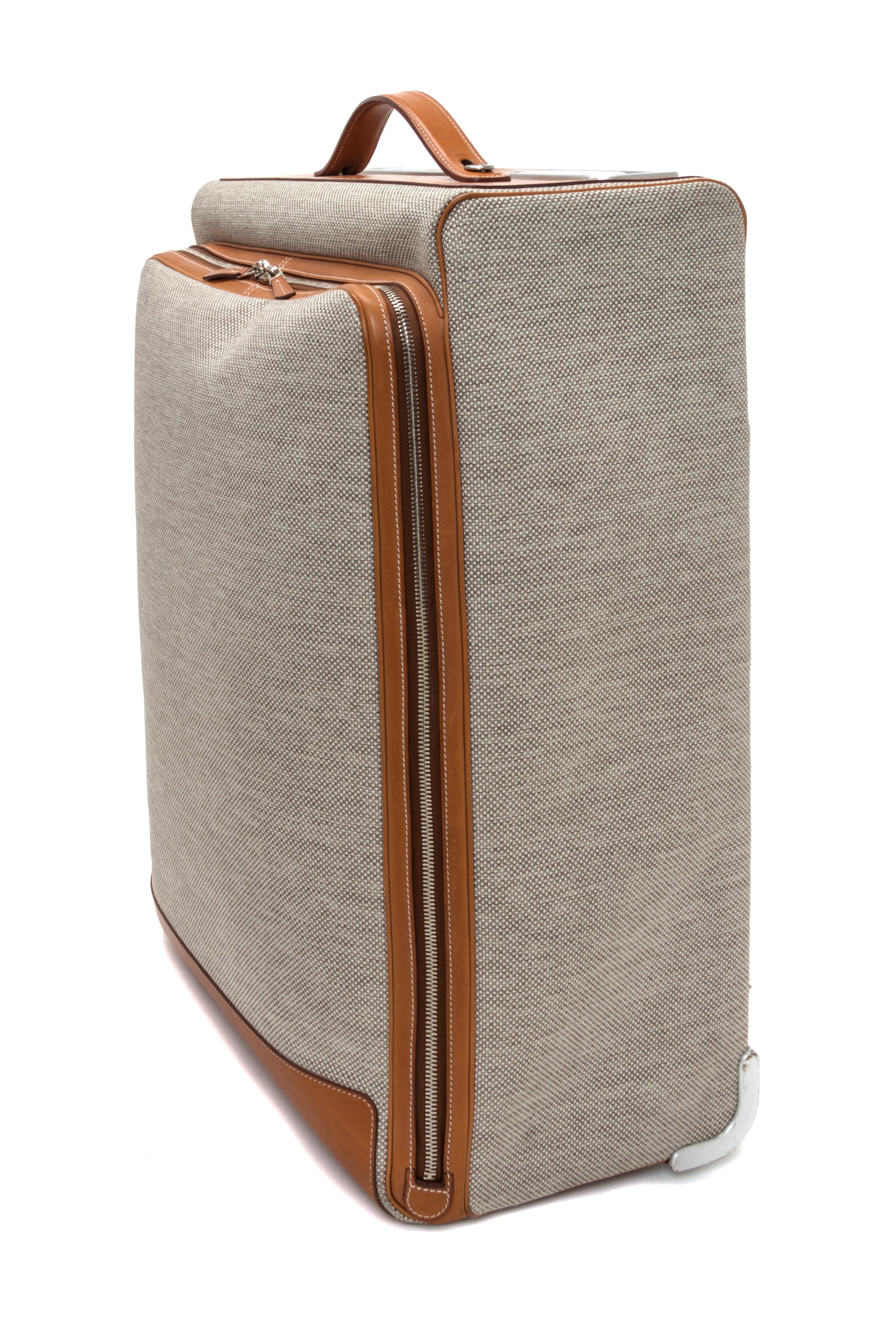 An Hermes Ecru Canvas and Fawn Barenia Calfskin Caleche-Express Suitcase, 14" x 21.5" x 10".