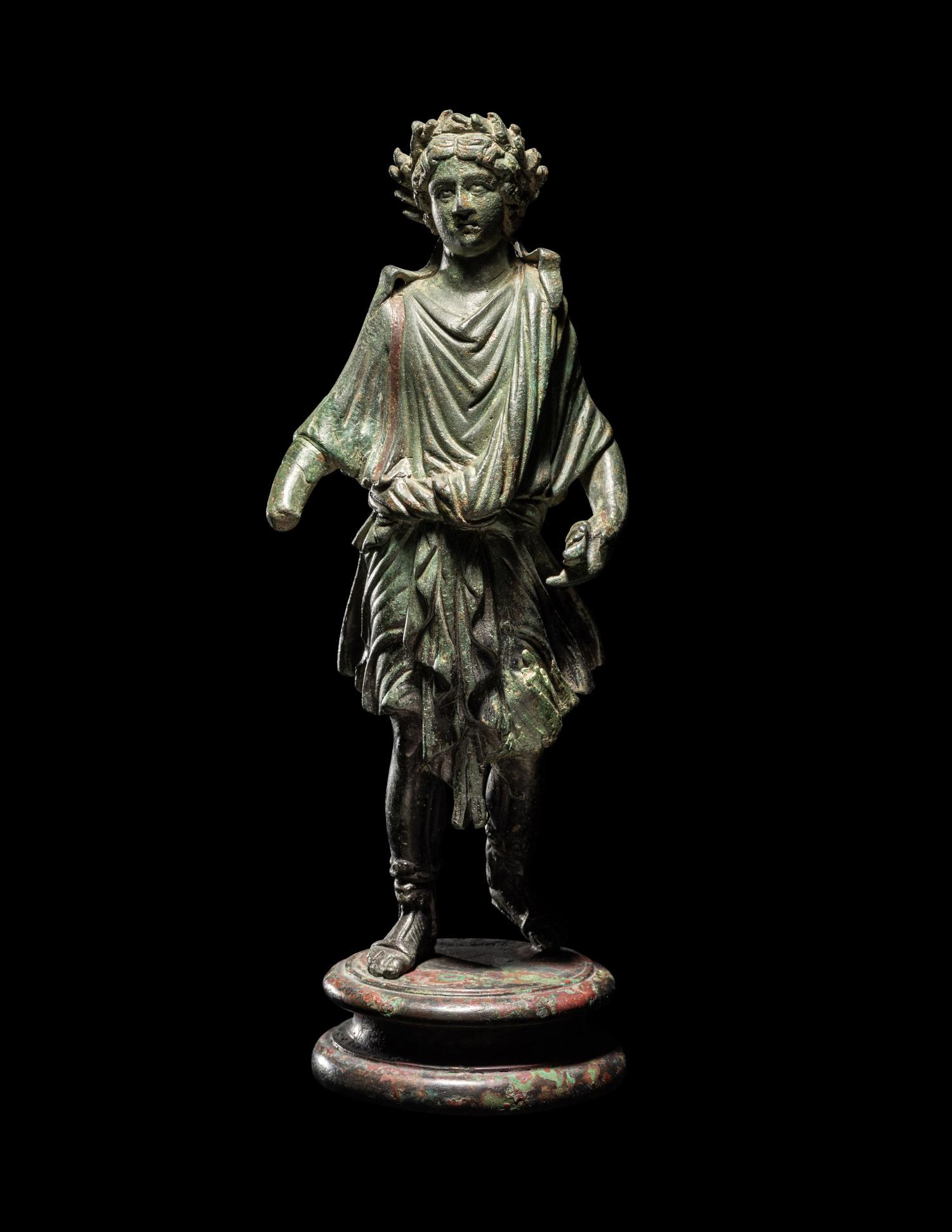 A Roman Bronze Lar with Copper Inlay