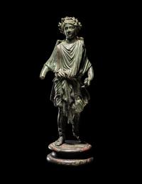 A Roman Bronze Lar with Copper Inlay