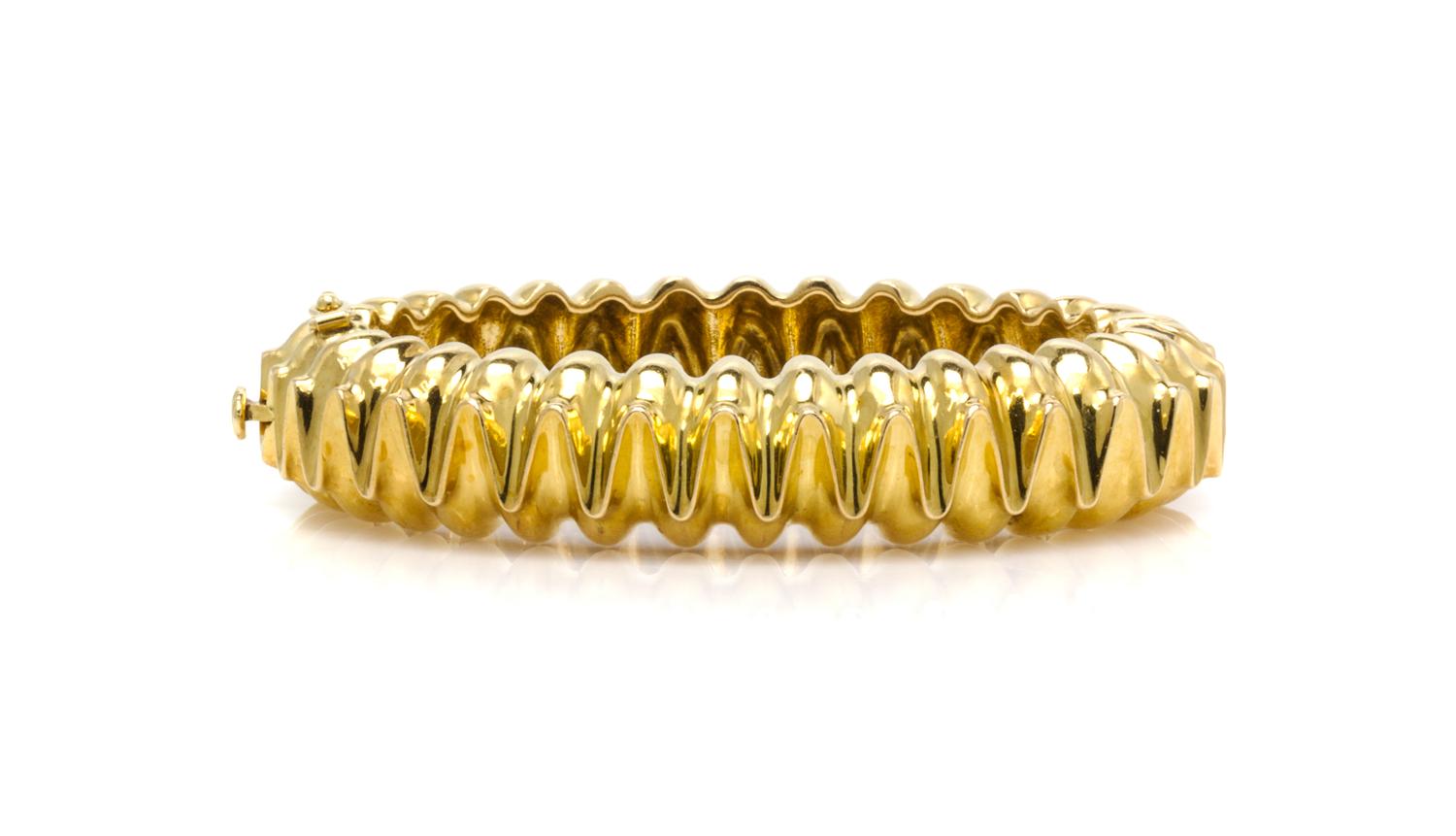 An 18 Karat Yellow Gold Hinged Bangle Bracelet, Tiffany & Co., Circa 1973, 44.40 dwts.