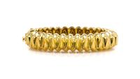 An 18 Karat Yellow Gold Hinged Bangle Bracelet, Tiffany & Co., Circa 1973, 44.40 dwts.