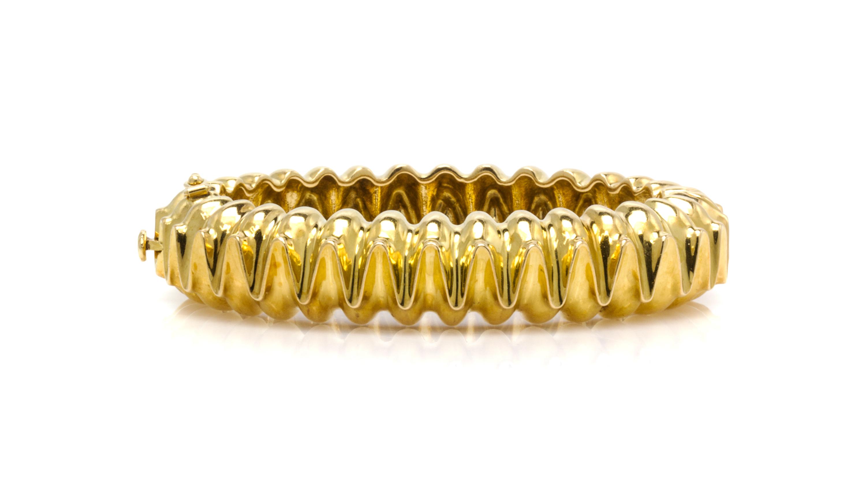 An 18 Karat Yellow Gold Hinged Bangle Bracelet, Tiffany & Co., Circa 1973, 44.40 dwts.