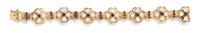 A 14 Karat Yellow Gold, Cultured Pearl and Sapphire Bracelet, 23.30 dwts.
