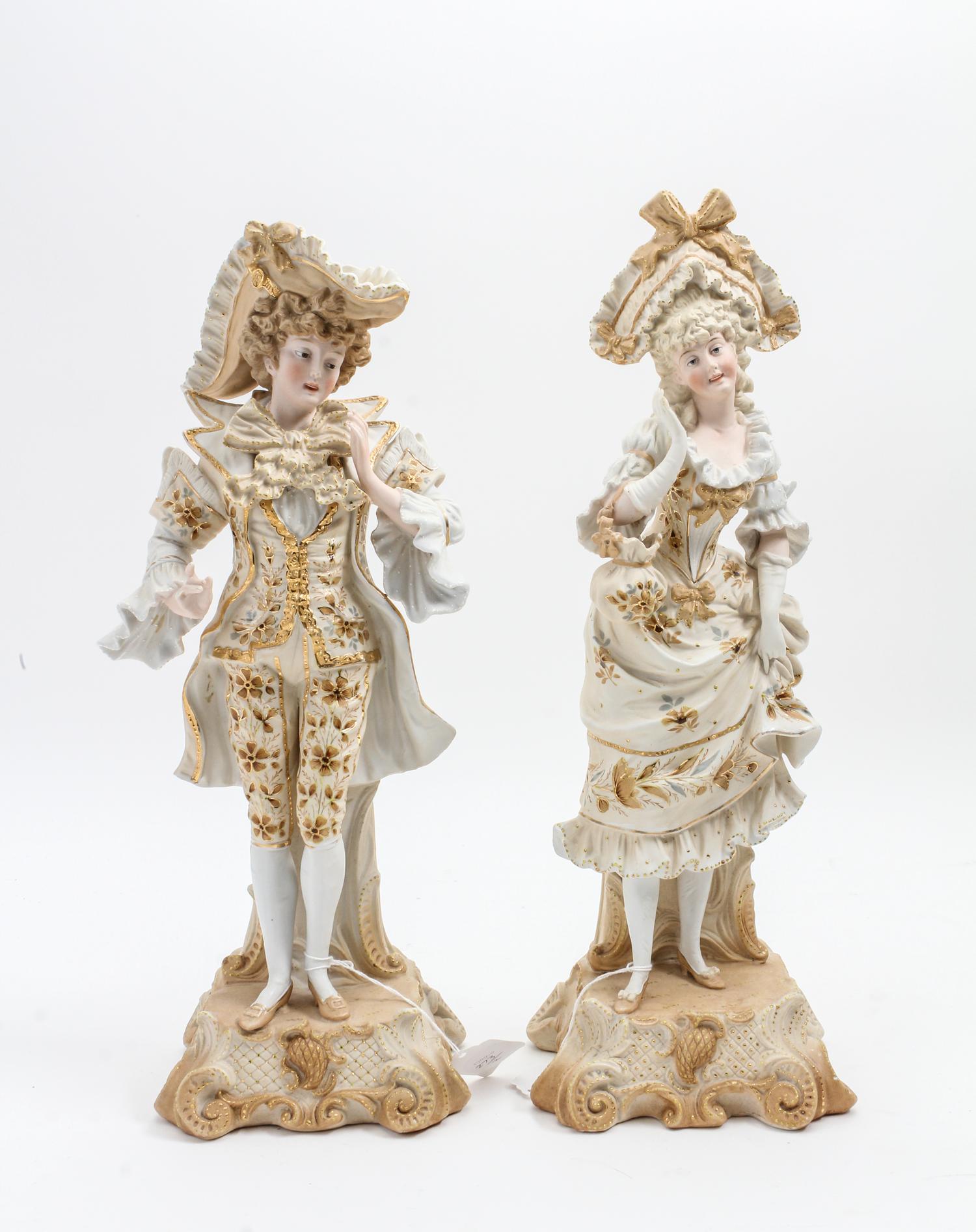 A Pair of Continental Bisque Porcelain Figures Height 16 inches. — 19TH/20TH CENTURY