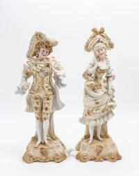 A Pair of Continental Bisque Porcelain Figures Height 16 inches. — 19TH/20TH CENTURY