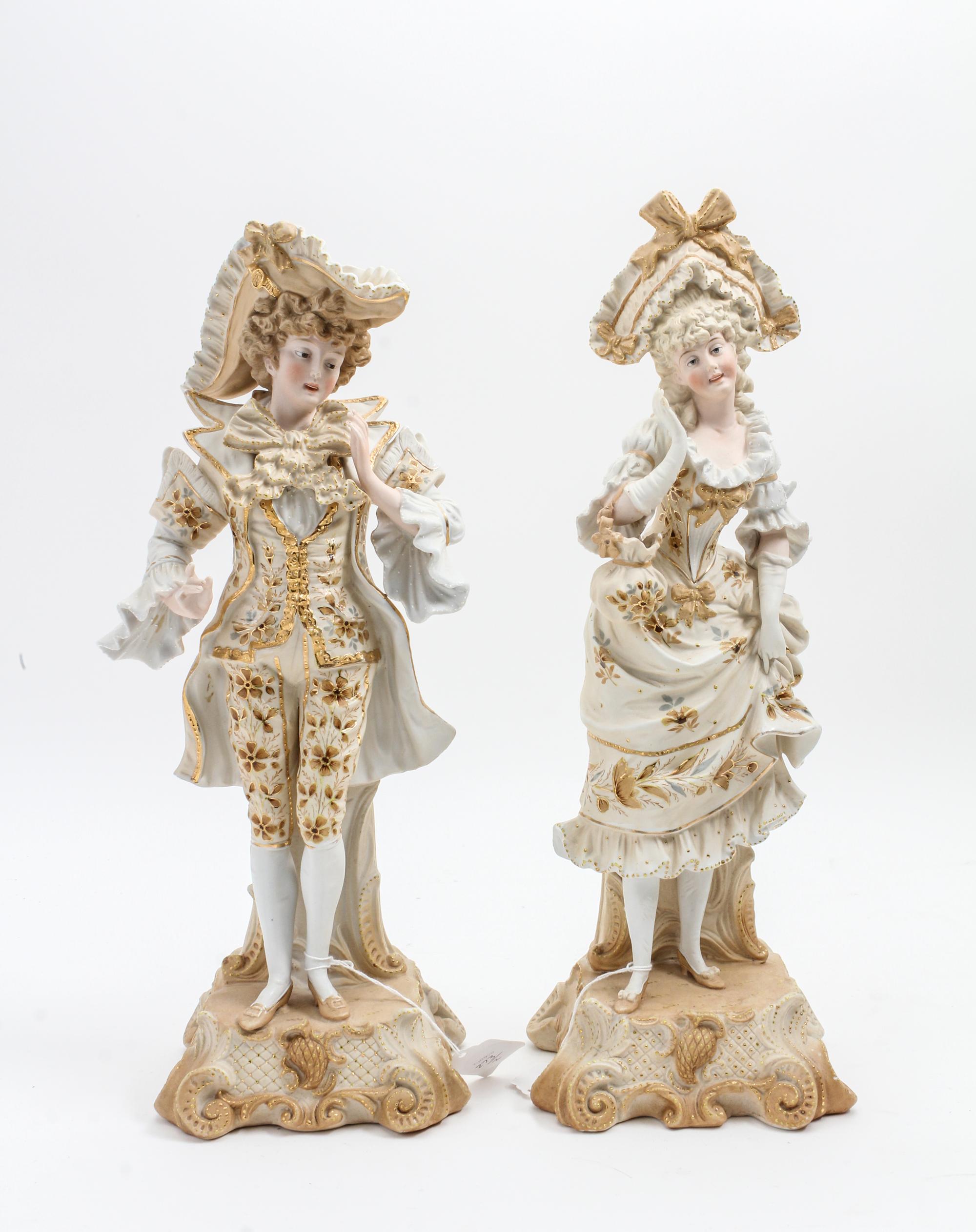 A Pair of Continental Bisque Porcelain Figures Height 16 inches. — 19TH/20TH CENTURY