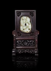 A Chinese White Jade Inset Hardwood Table Screen Height 9 1/8 inches.