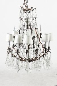 A French Patinated Metal and Cut Glass Eight-Light Chandelier
