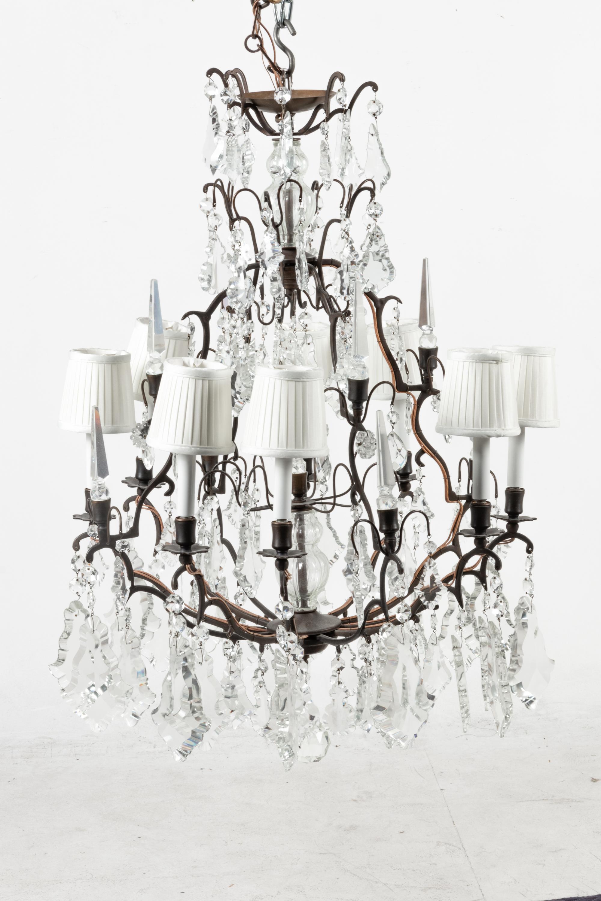 A French Patinated Metal and Cut Glass Eight-Light Chandelier