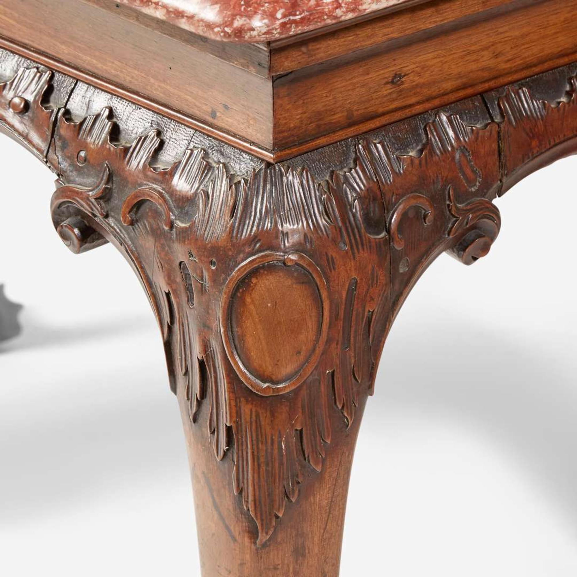 A George II carved walnut side table with breccia marble top circa 1750