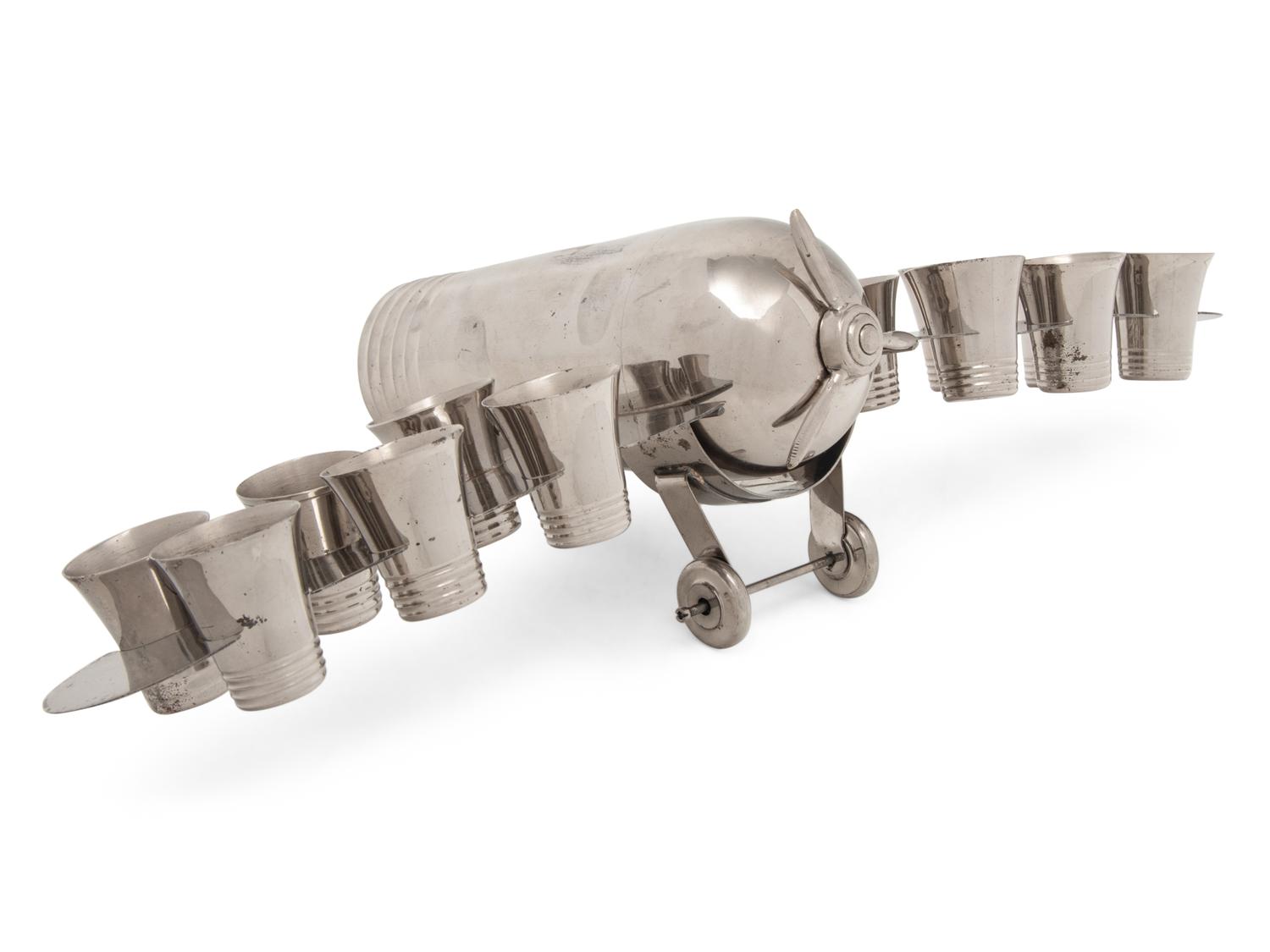 A Silver-Plate Airplane-Form Cocktail Shaker and Shot Glass Set