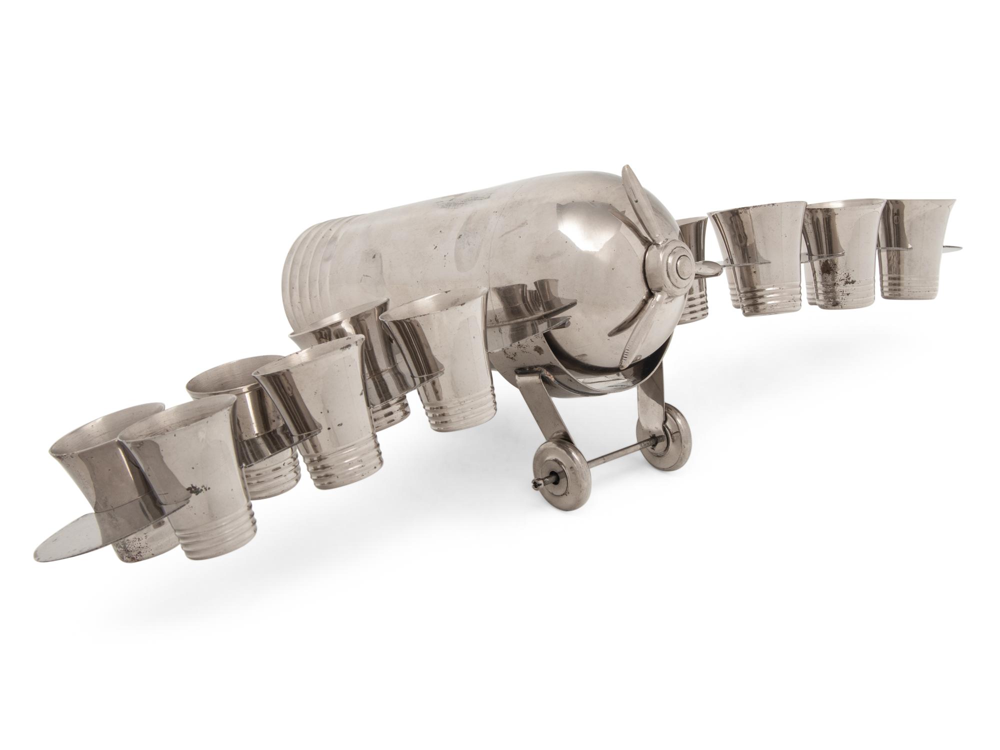 A Silver-Plate Airplane-Form Cocktail Shaker and Shot Glass Set