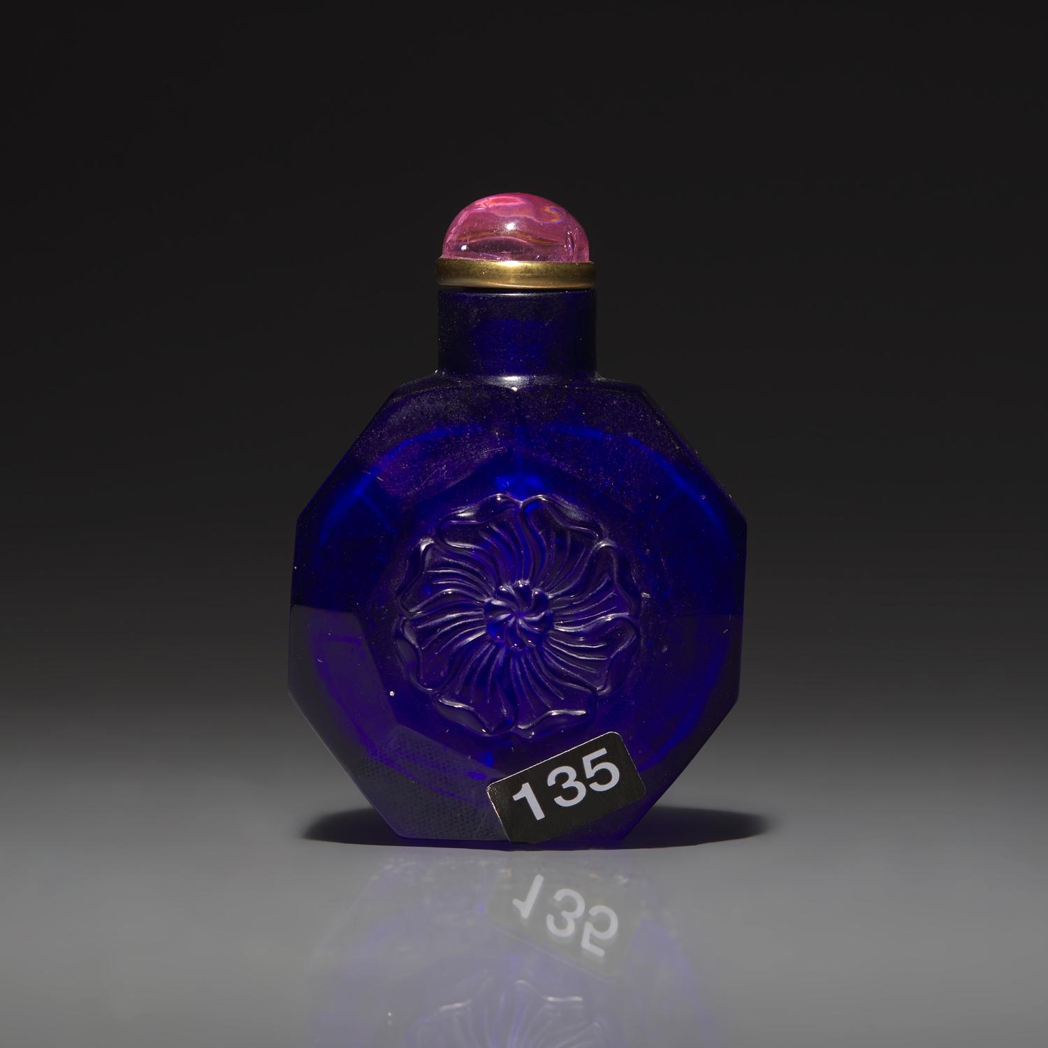 A Chinese Carved Cobalt Blue Glass Snuff Bottle, 18th Century 清中期 寶石藍料刻花鼻烟壺