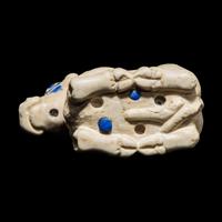 A Mesopotamian Marble and Lapis Lazuli Inlay Recumbent Calf