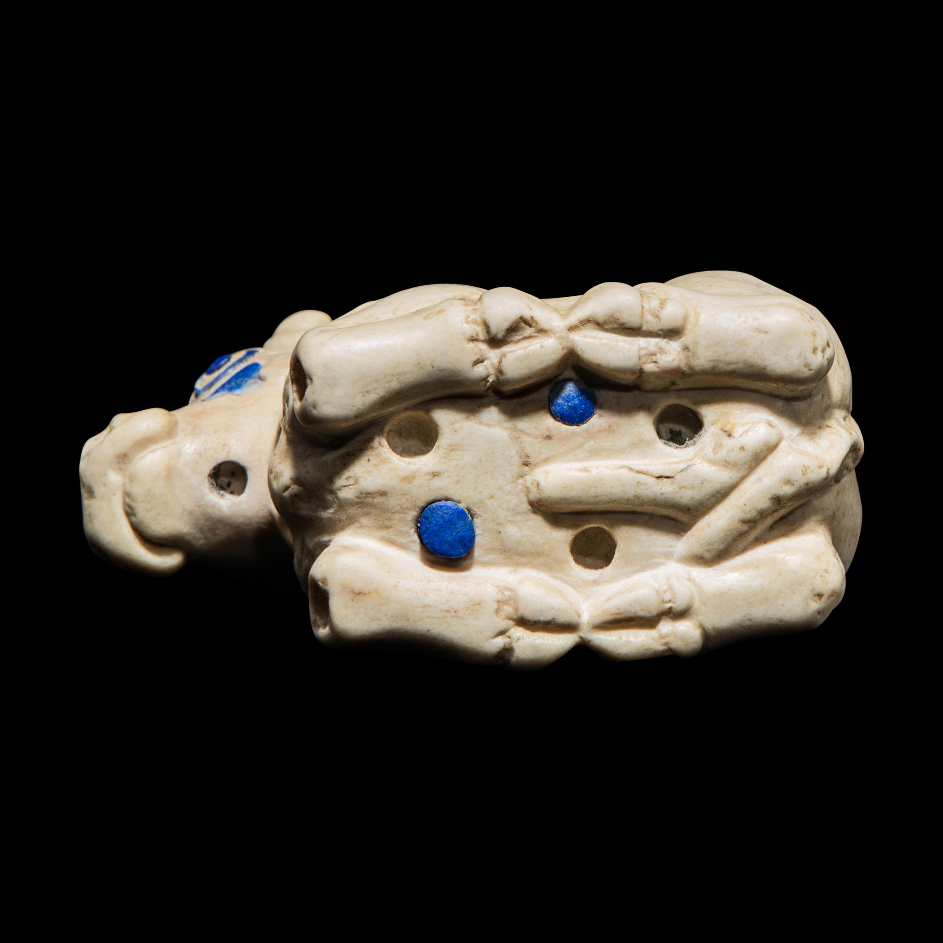 A Mesopotamian Marble and Lapis Lazuli Inlay Recumbent Calf