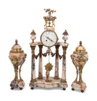 A Louis XVI Style Gilt Metal Mounted Marble Clock Garniture