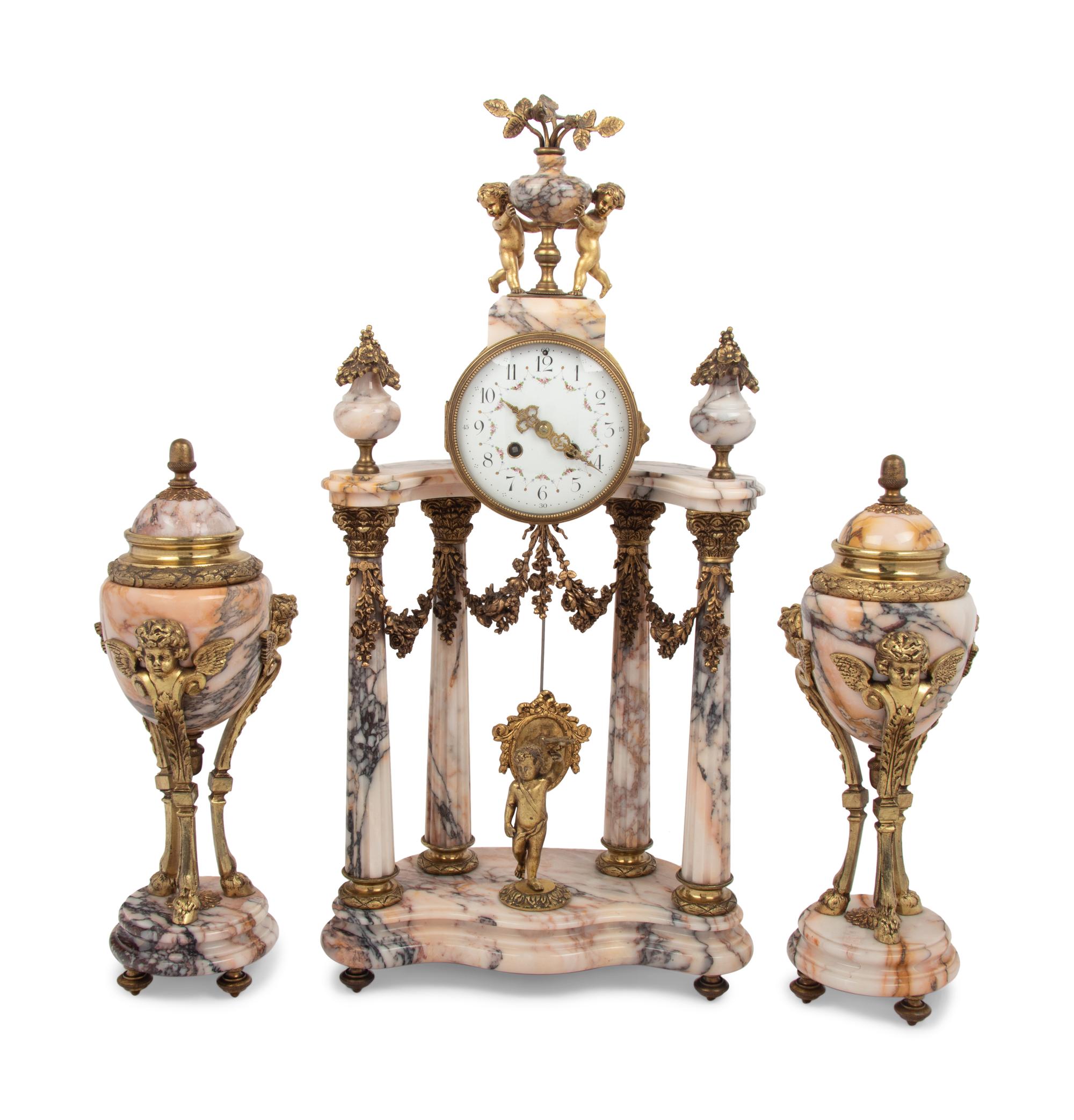 A Louis XVI Style Gilt Metal Mounted Marble Clock Garniture