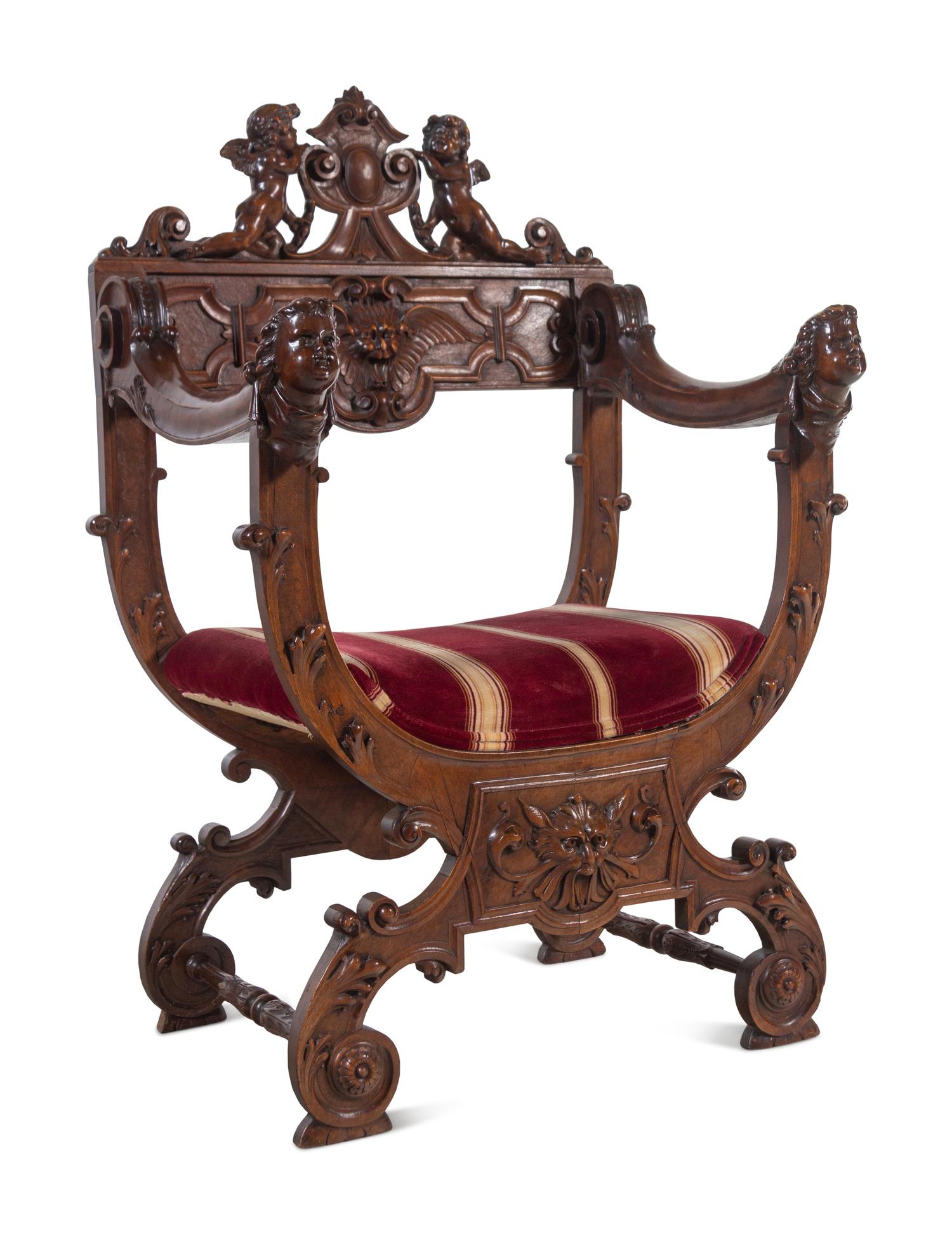 A Renaissance Revival Carved Walnut Savonarola Chair
