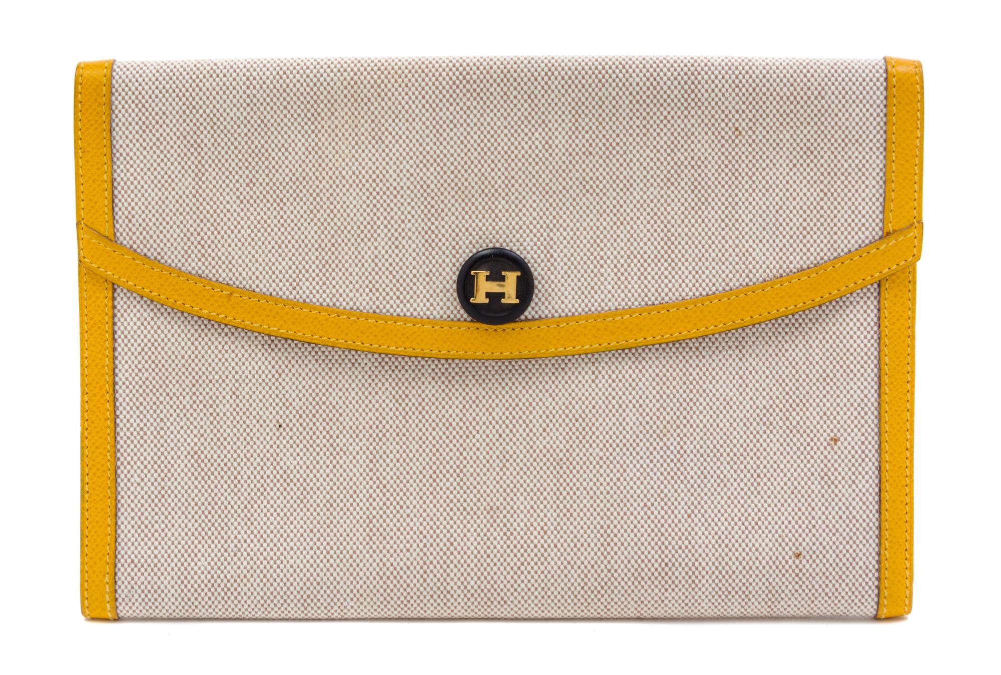 An Hermes Cream Toile and Yellow Leather Rio Clutch, 8.5" x 6" x 1.5".