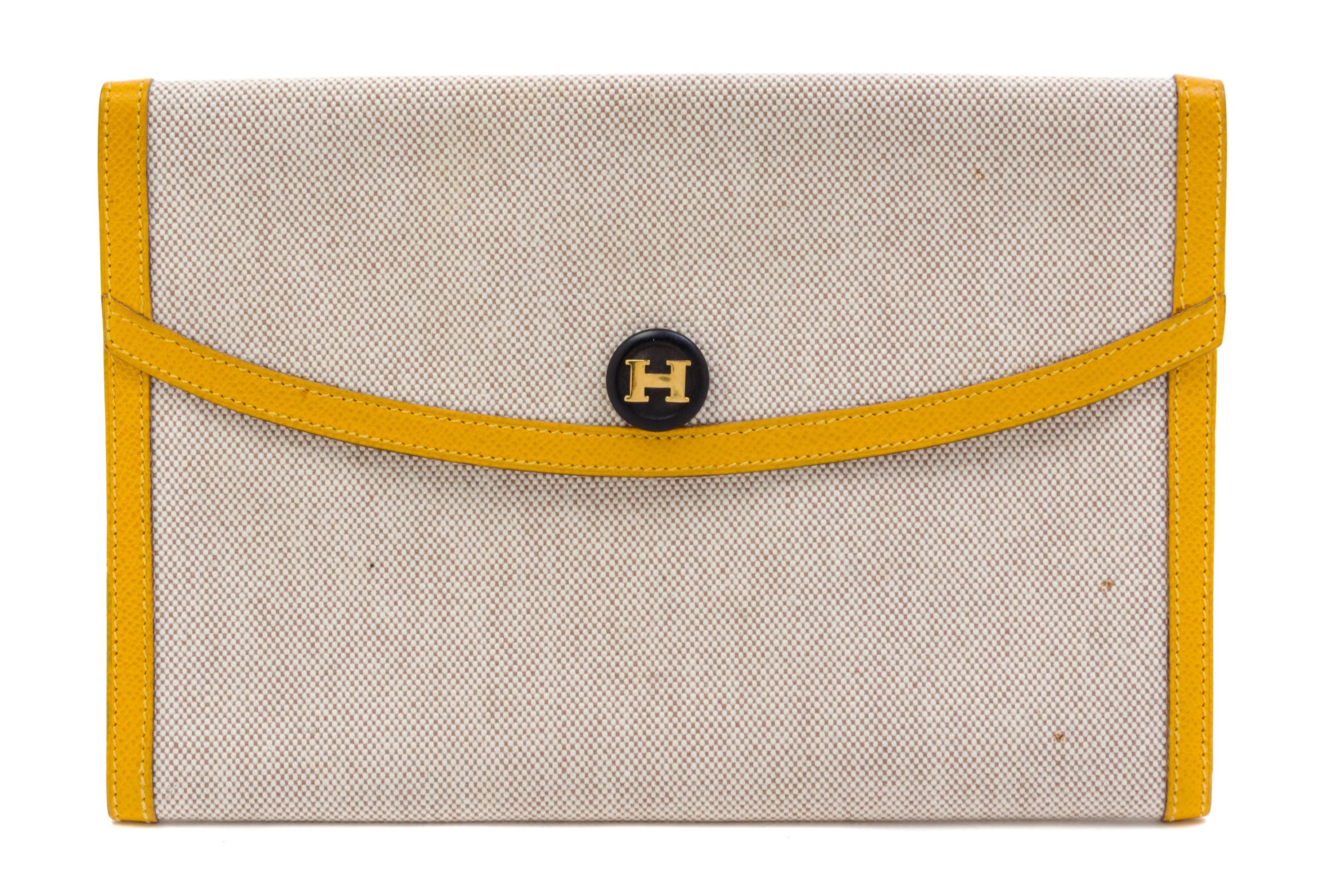 An Hermes Cream Toile and Yellow Leather Rio Clutch, 8.5" x 6" x 1.5".